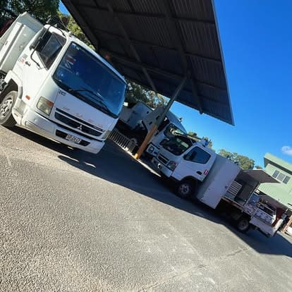 Commercial trucks at a workshop