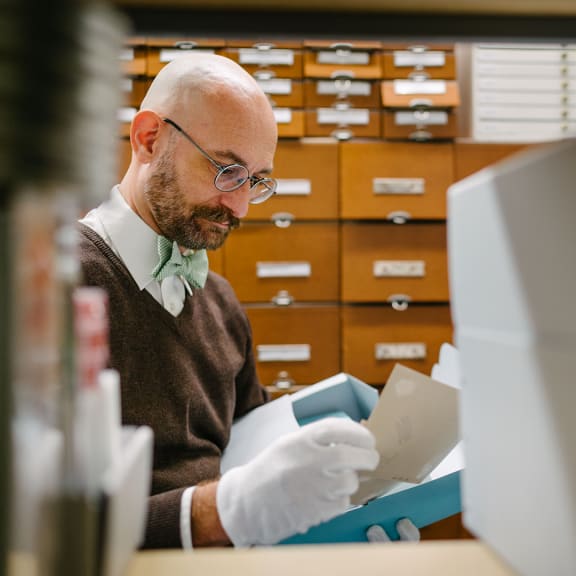 Dr. Florian Oexler pictured looking over notes.