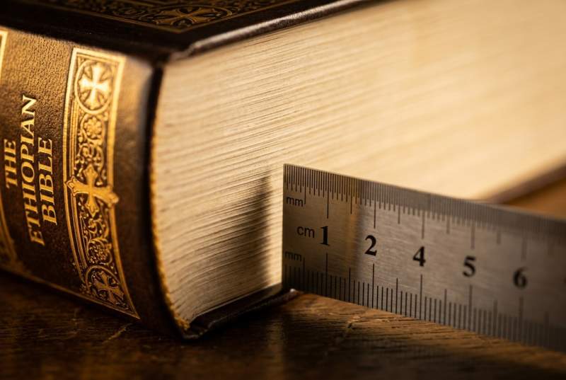 Open Bible showing Jude 1:14-15, the New Testament passage that directly quotes the Book of Enoch