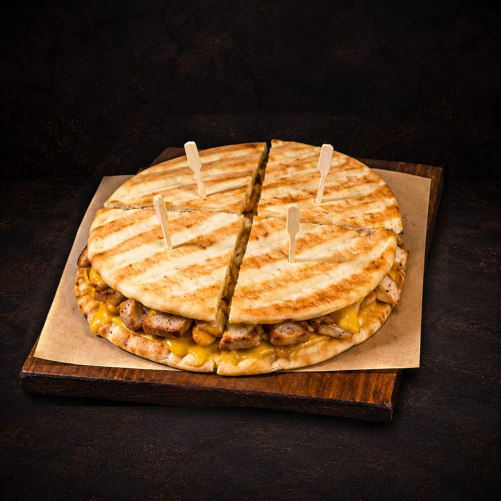 Greek club pita with pork skewer