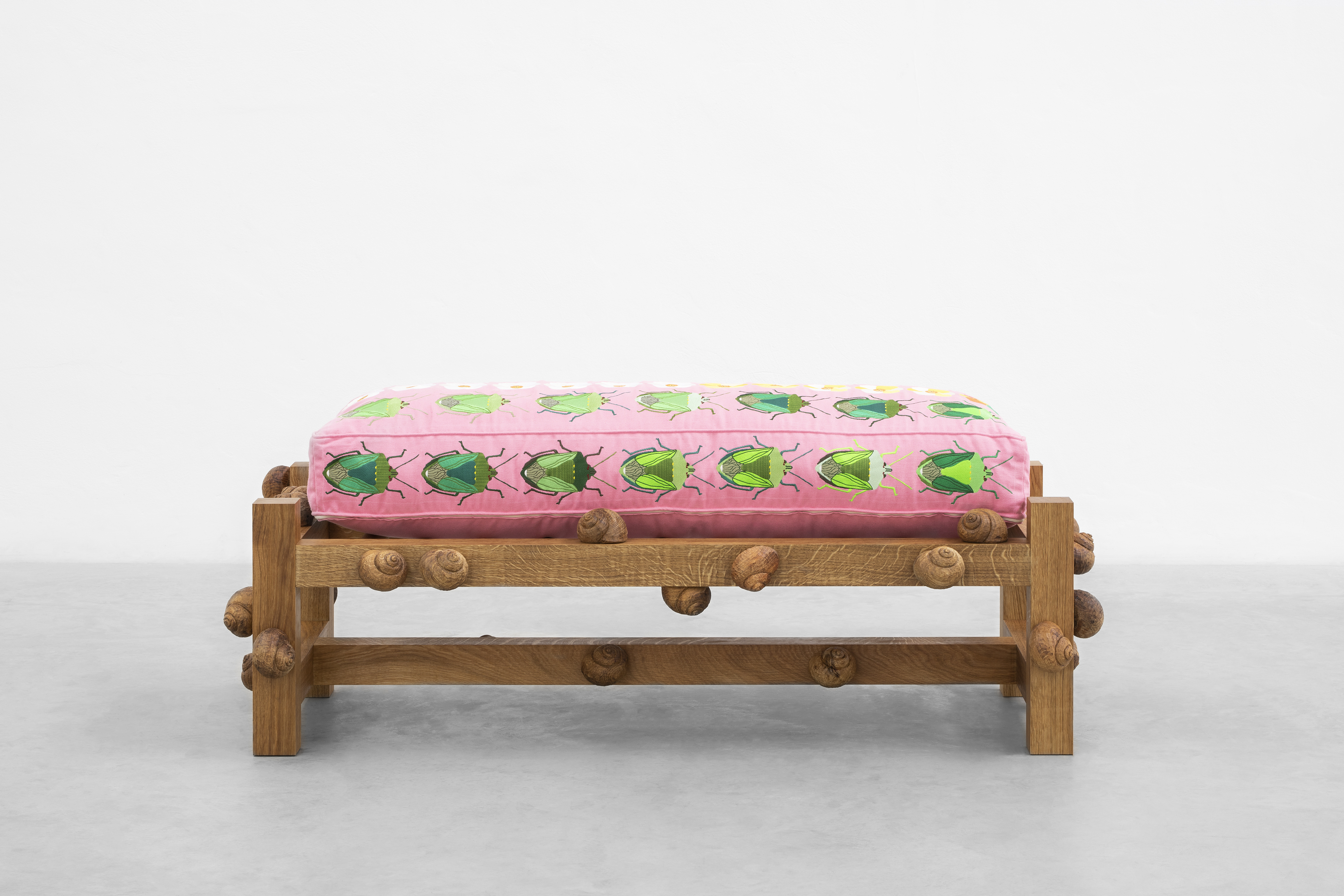 Oak bench with green stink bugs, prickly poppy flowers and snails