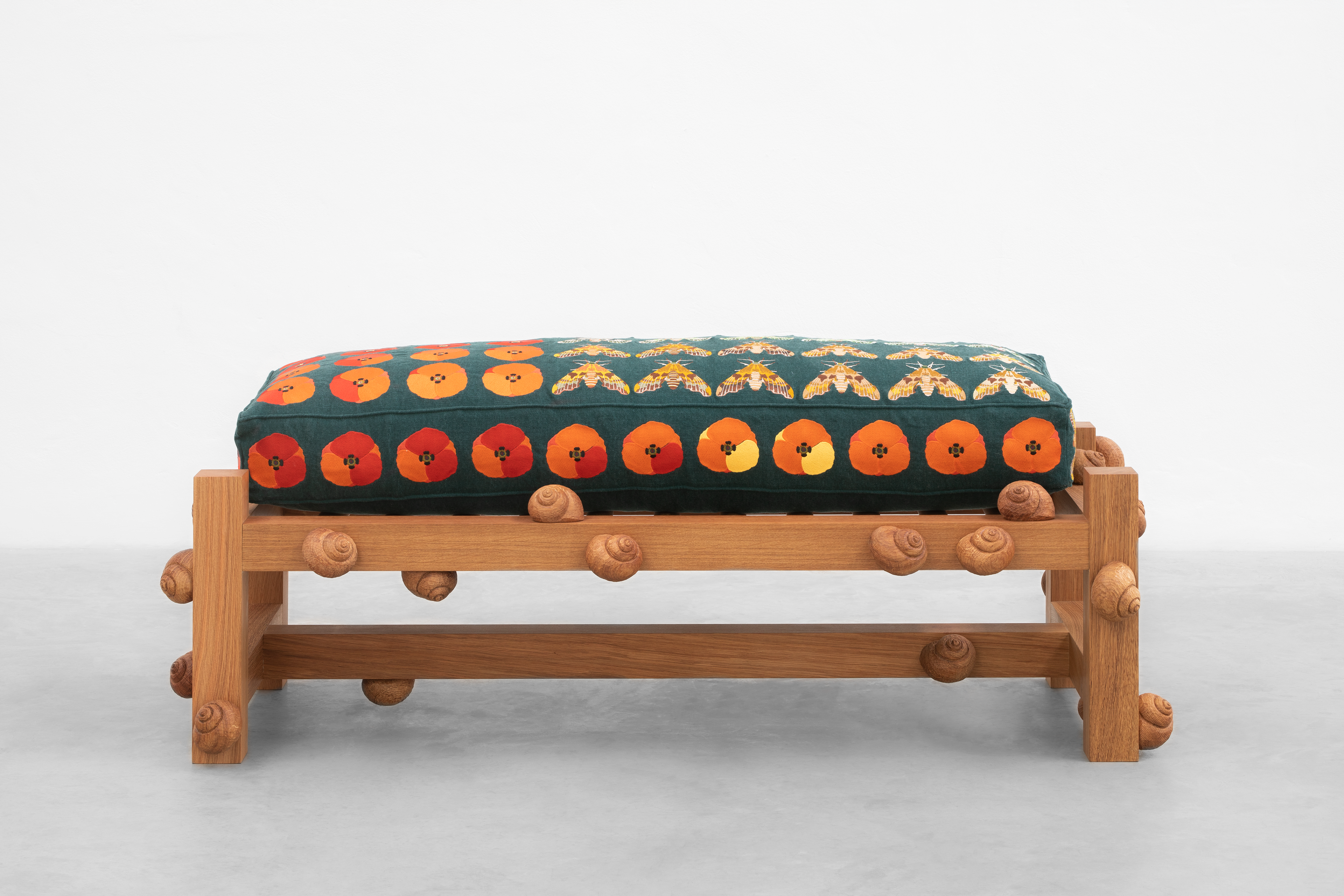 Oak bench with lime hawk moths, field poppy flowers and snails