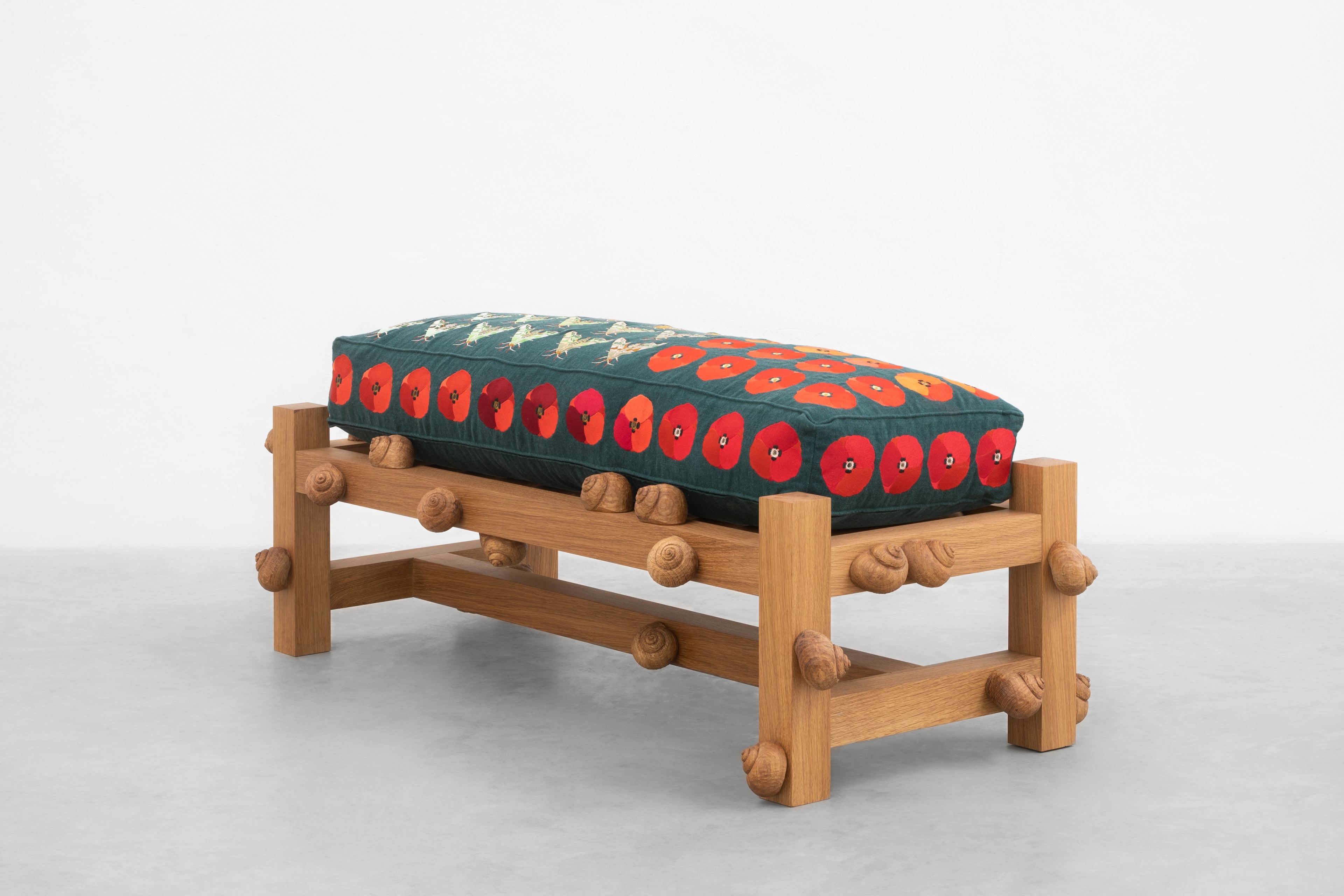 Oak bench with lime hawk moths, field poppy flowers and snails