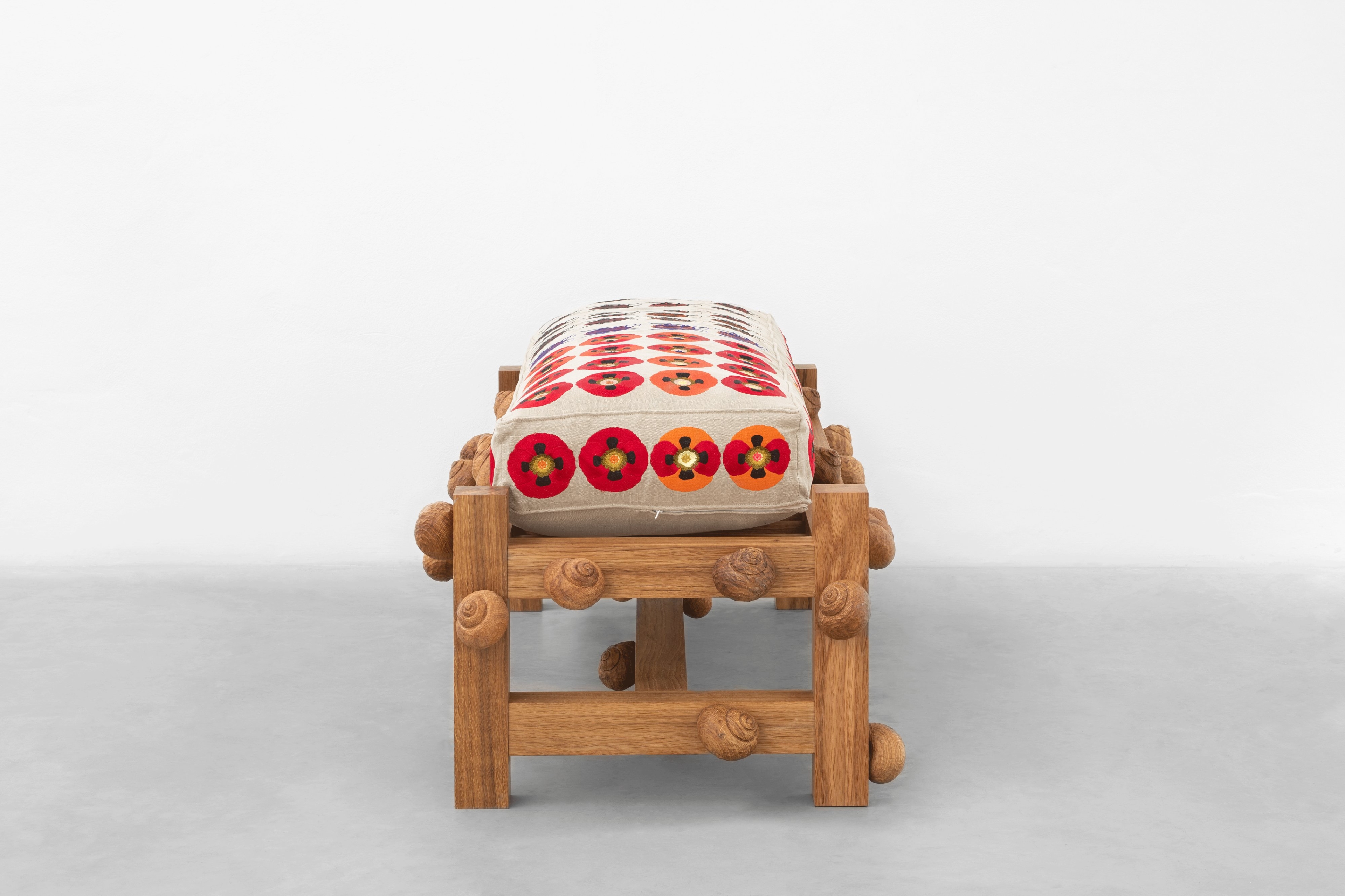Oak bench with striped shield bugs, opium poppy flowers and snails