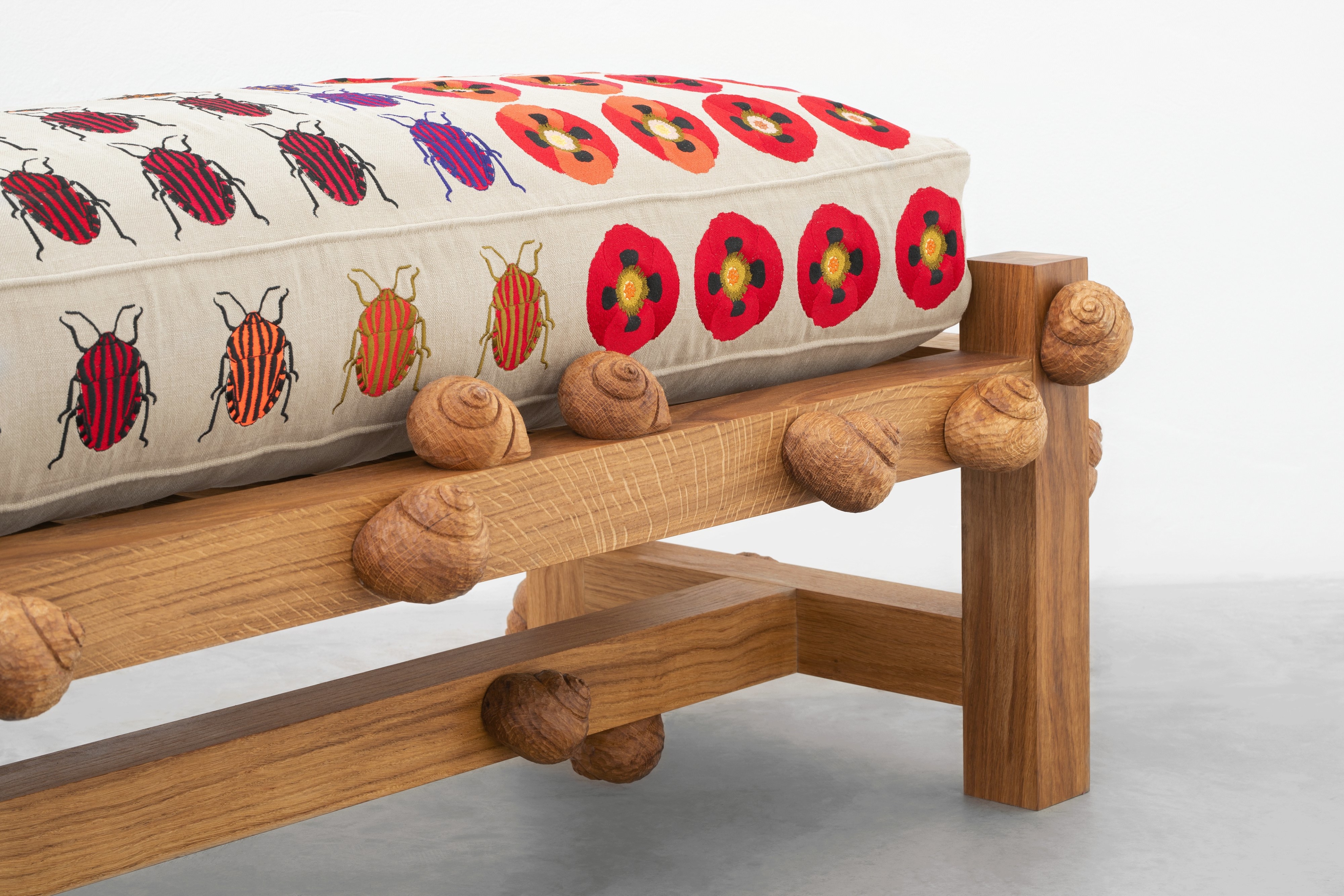 Oak bench with striped shield bugs, opium poppy flowers and snails