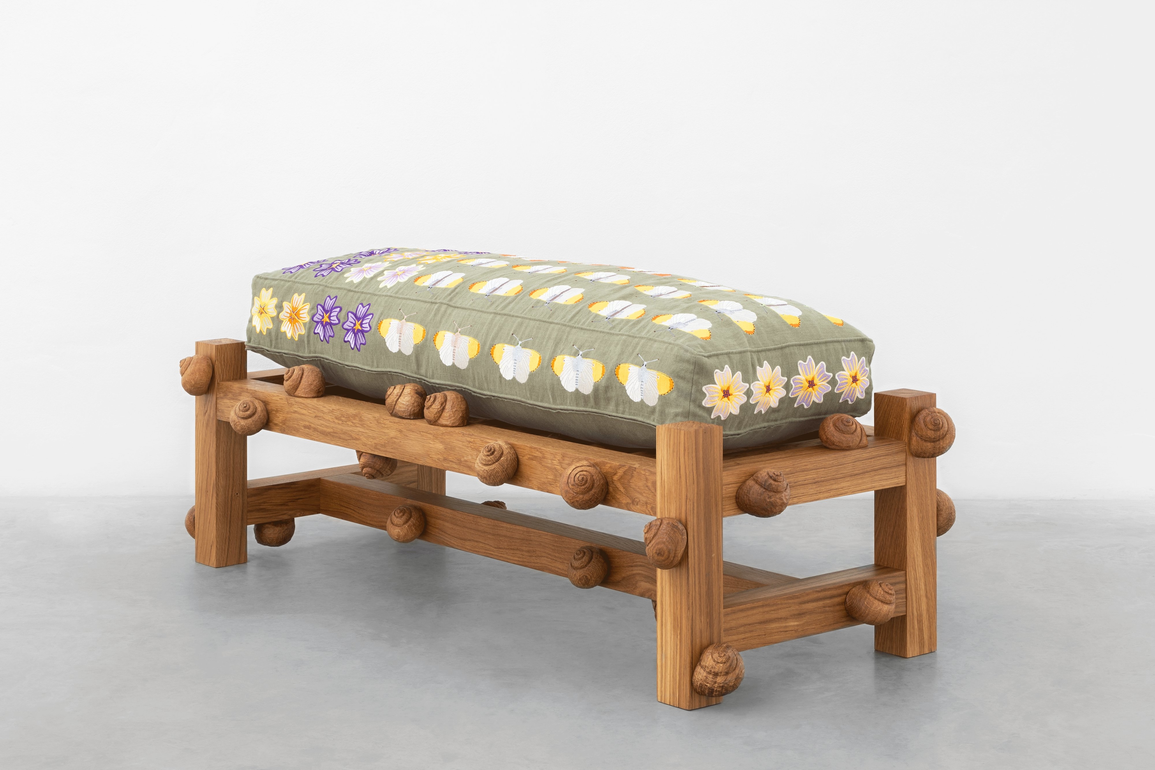 Oak bench with orange tip butterflies, mallow flowers and snails