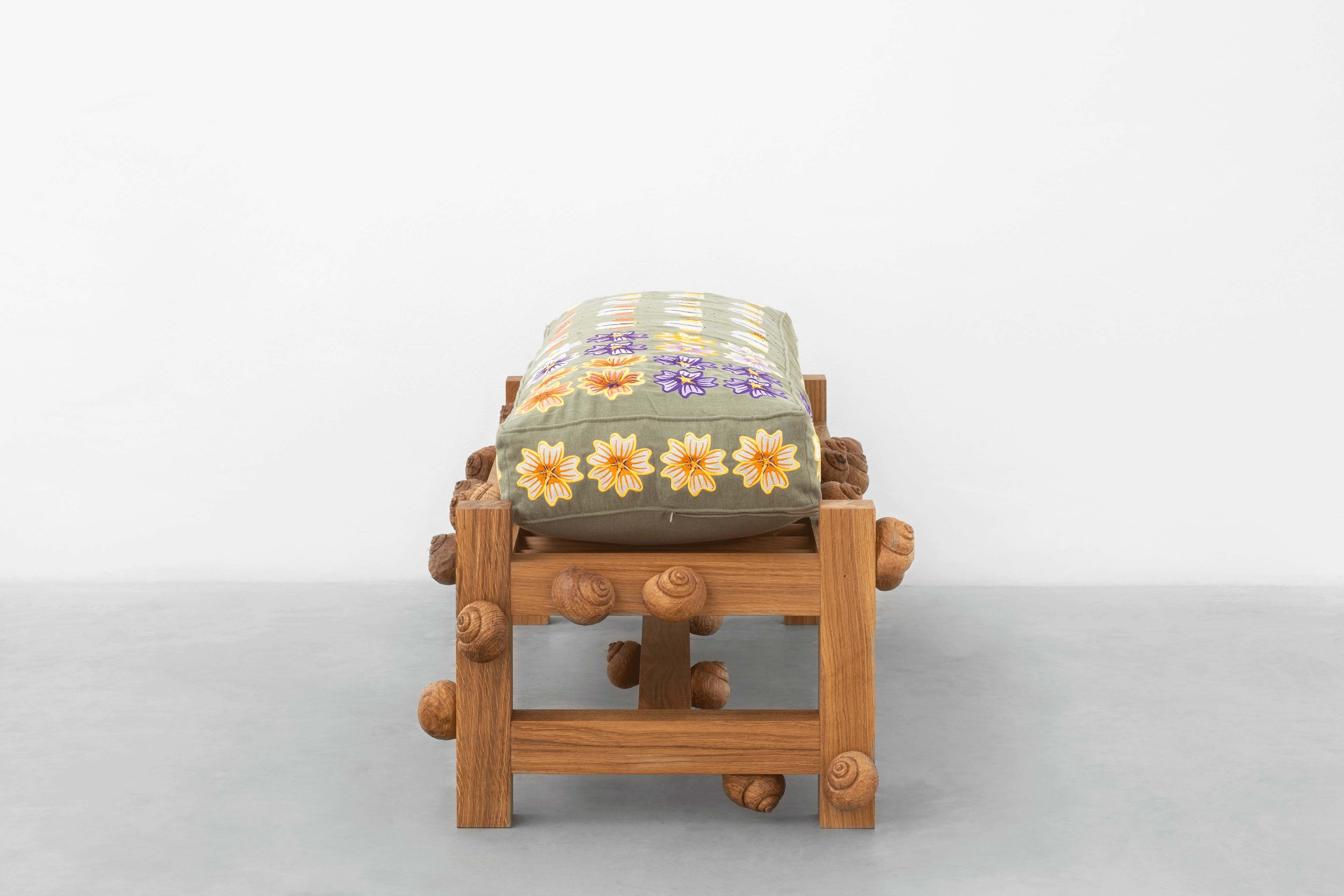 Oak bench with orange tip butterflies, mallow flowers and snails