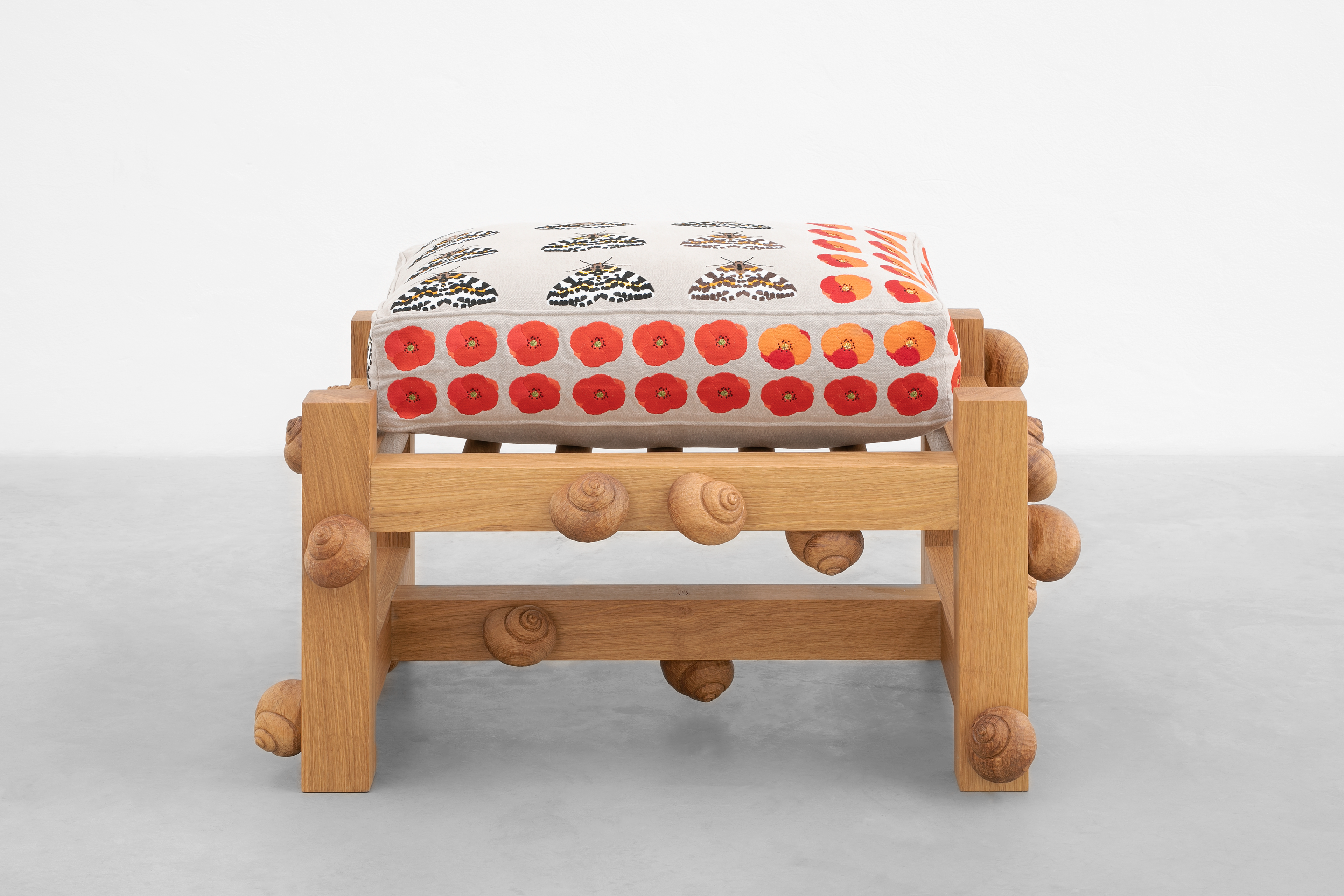 Oak bench with magpie moths, Flanders poppy flowers and snails