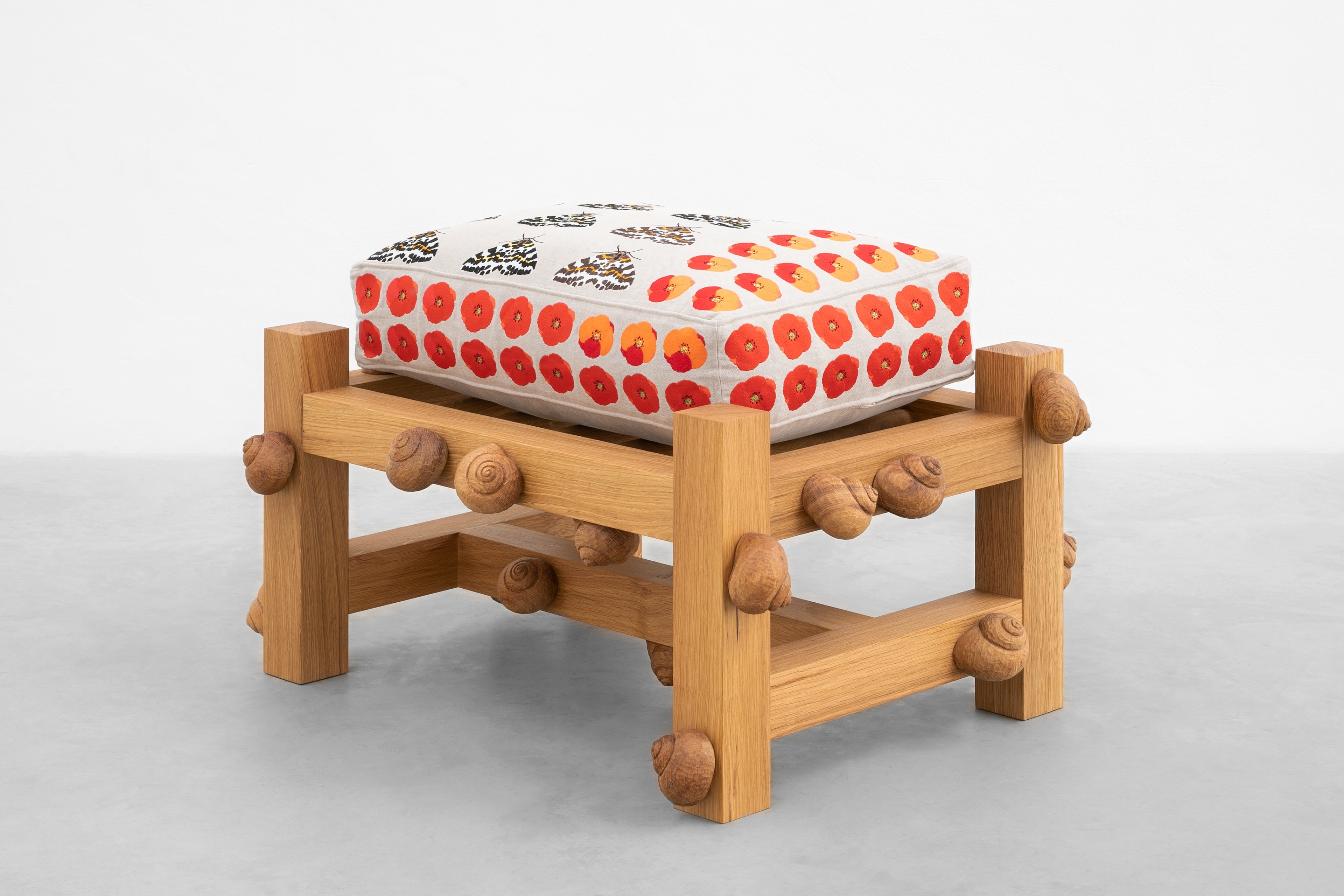 Oak bench with magpie moths, Flanders poppy flowers and snails