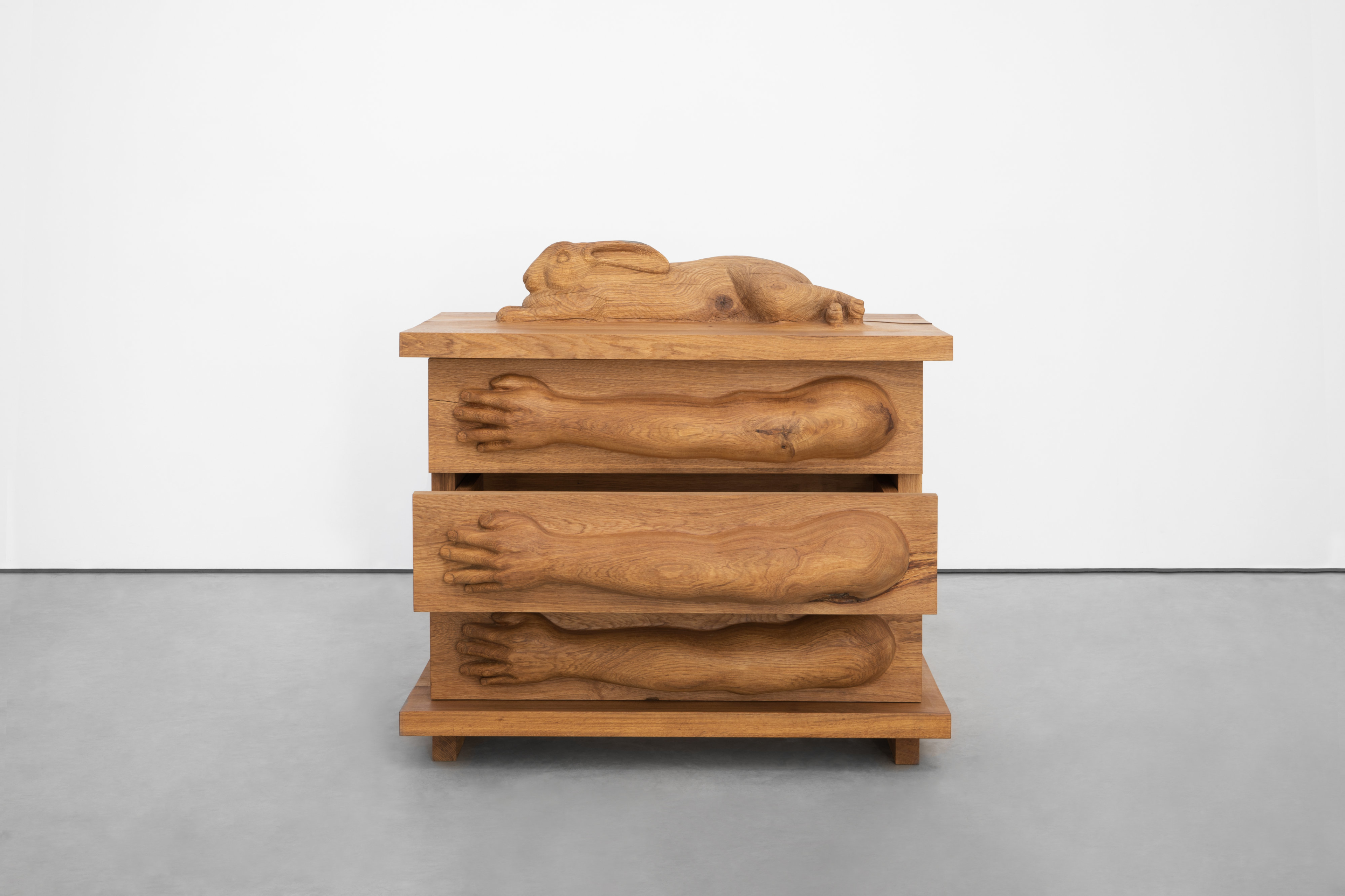 Oak chest of drawers with giant Flanders rabbit and arms