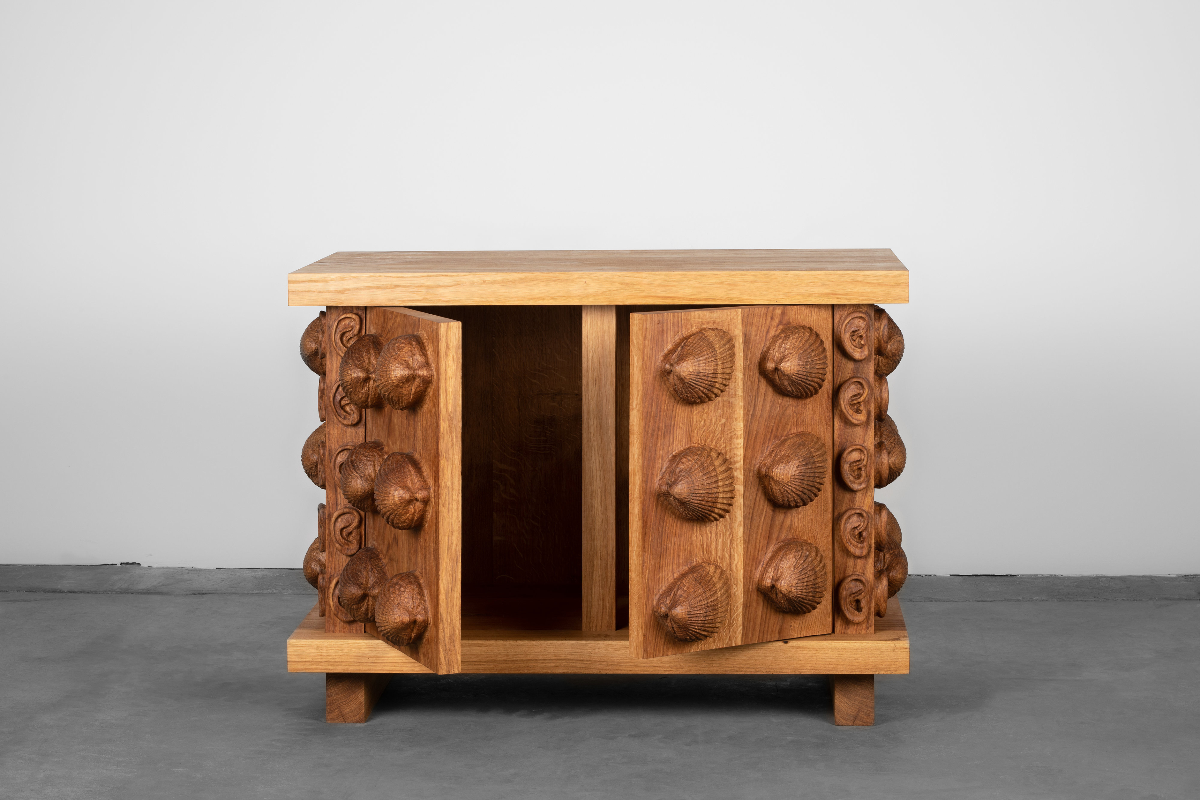Oak cabinet with cockles and ears