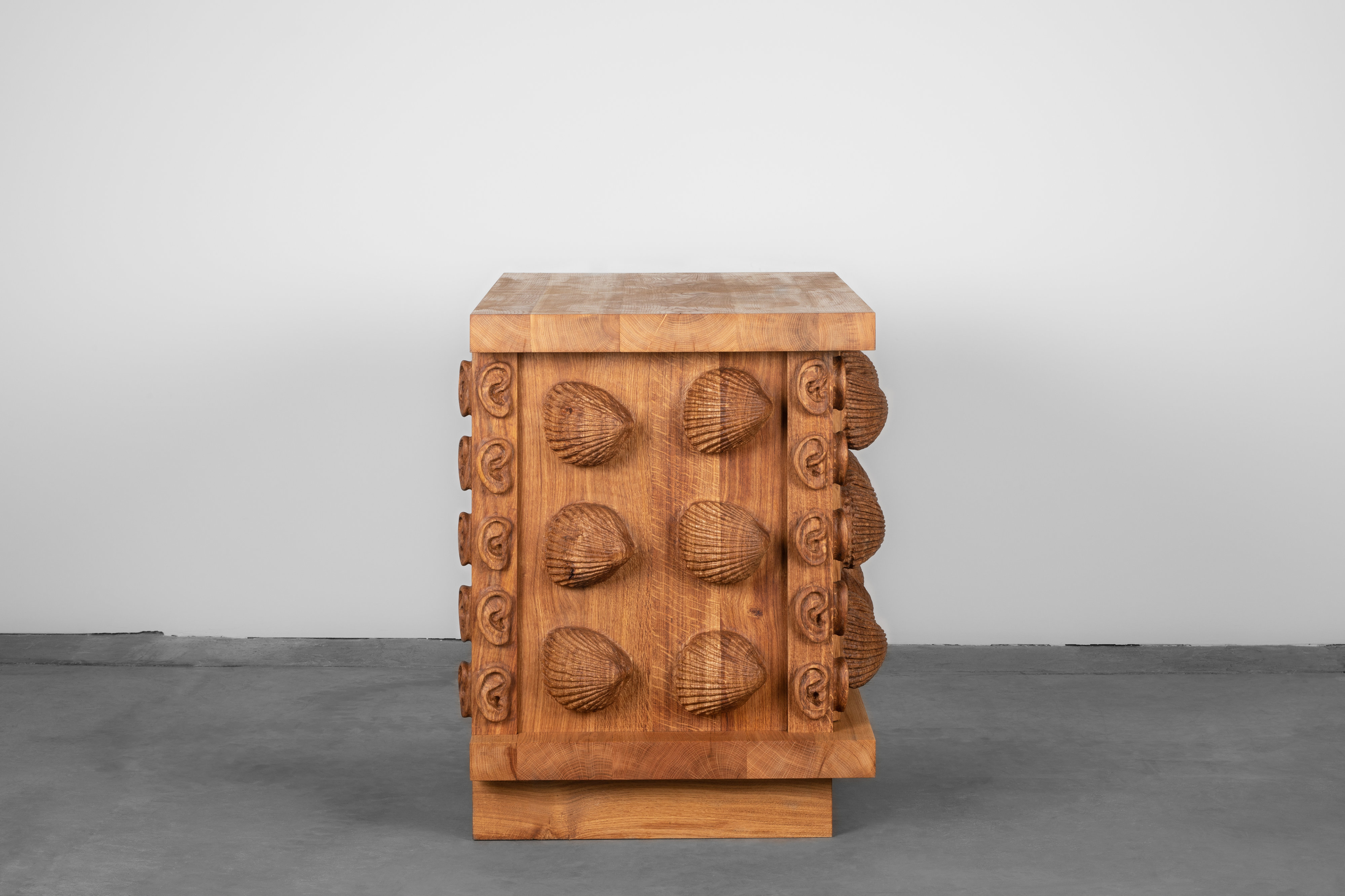 Oak cabinet with cockles and ears