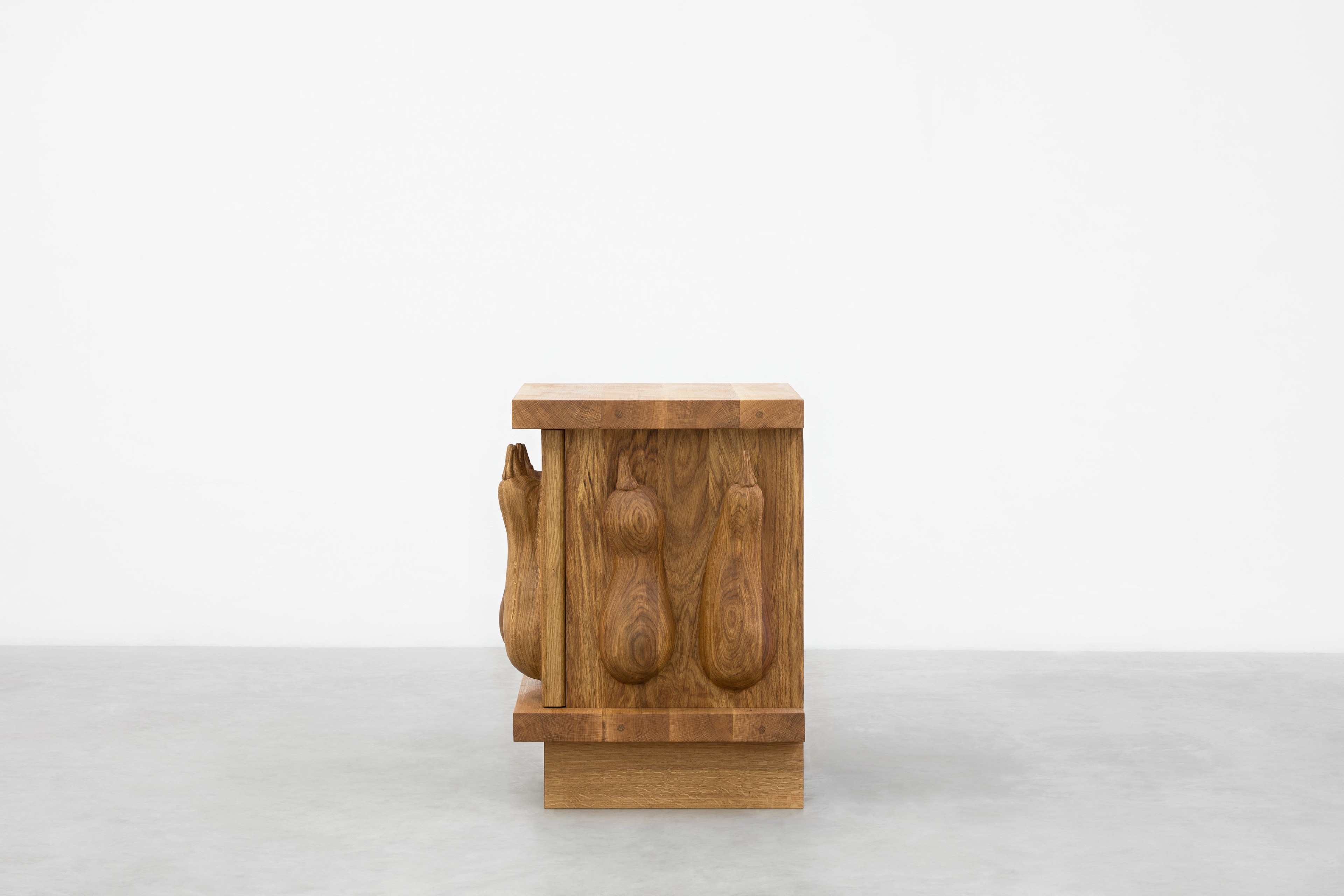 Oak cabinet with courgettes and snail