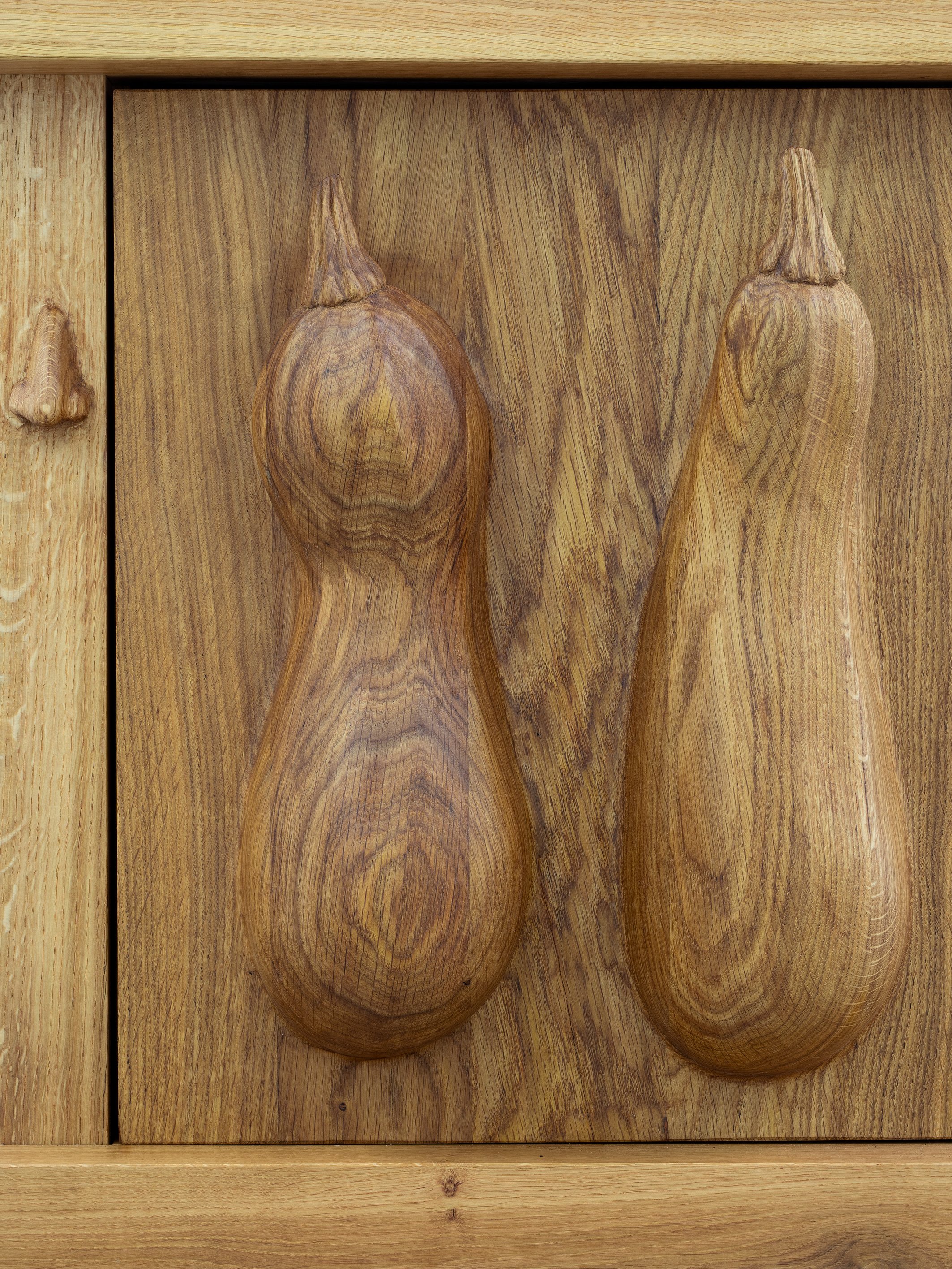 Oak cabinet with courgettes and snail