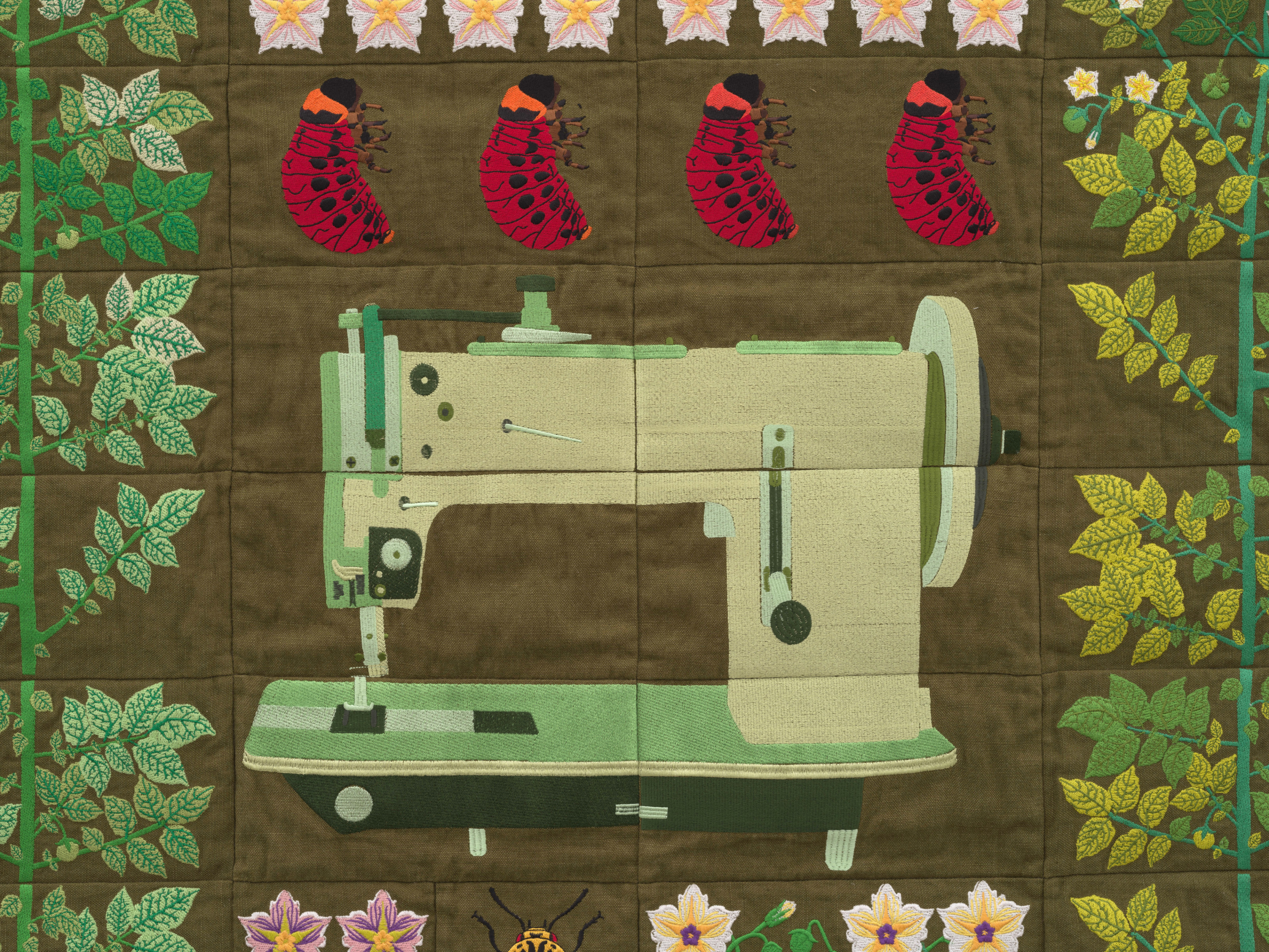 Embroidered quilt with earthworms, potato plants, clover plants, Colorado beetle larvae, Colorado be...