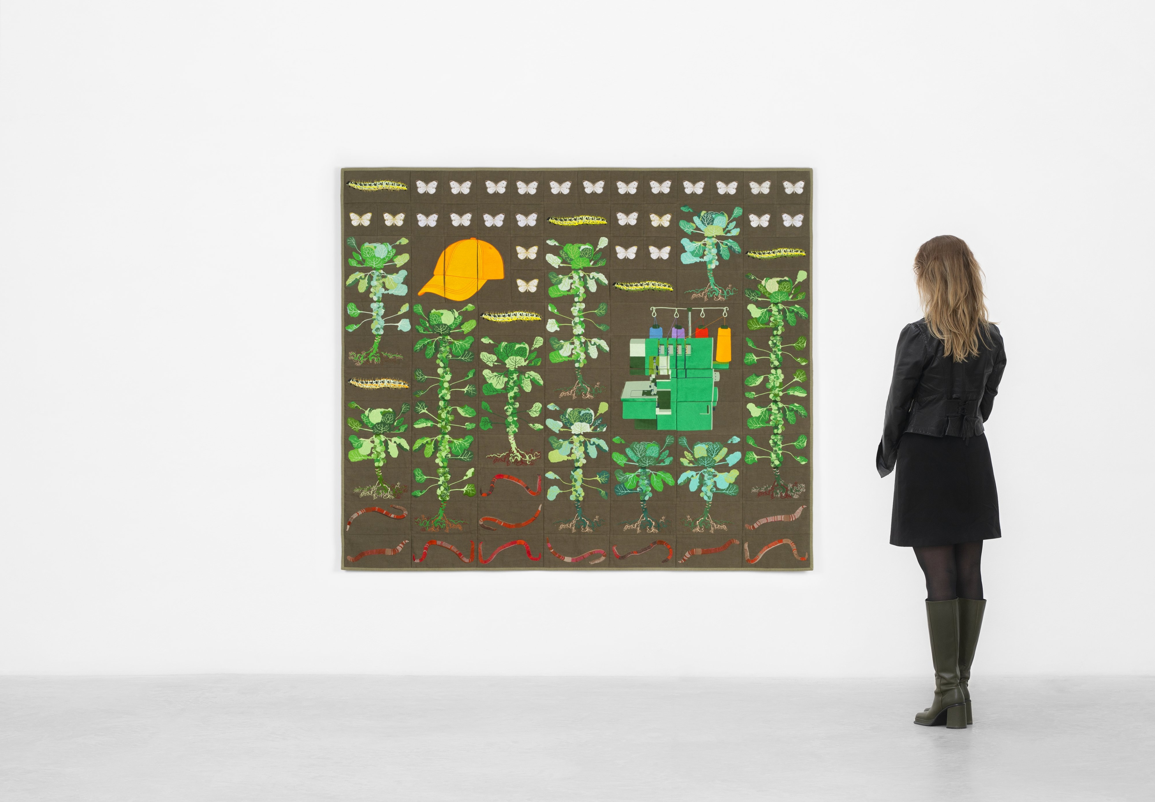 Embroidered quilt with earthworms, Brussels sprouts plants, cabbage white caterpillars, cabbage whit...
