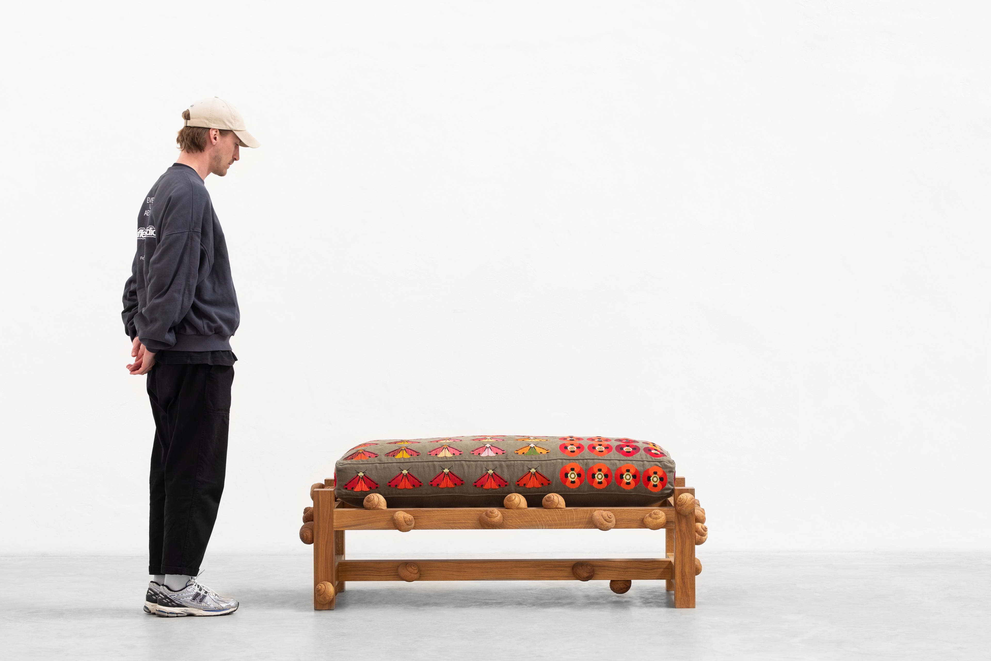 Oak bench with cinnabar moths, opium poppy flowers and snails