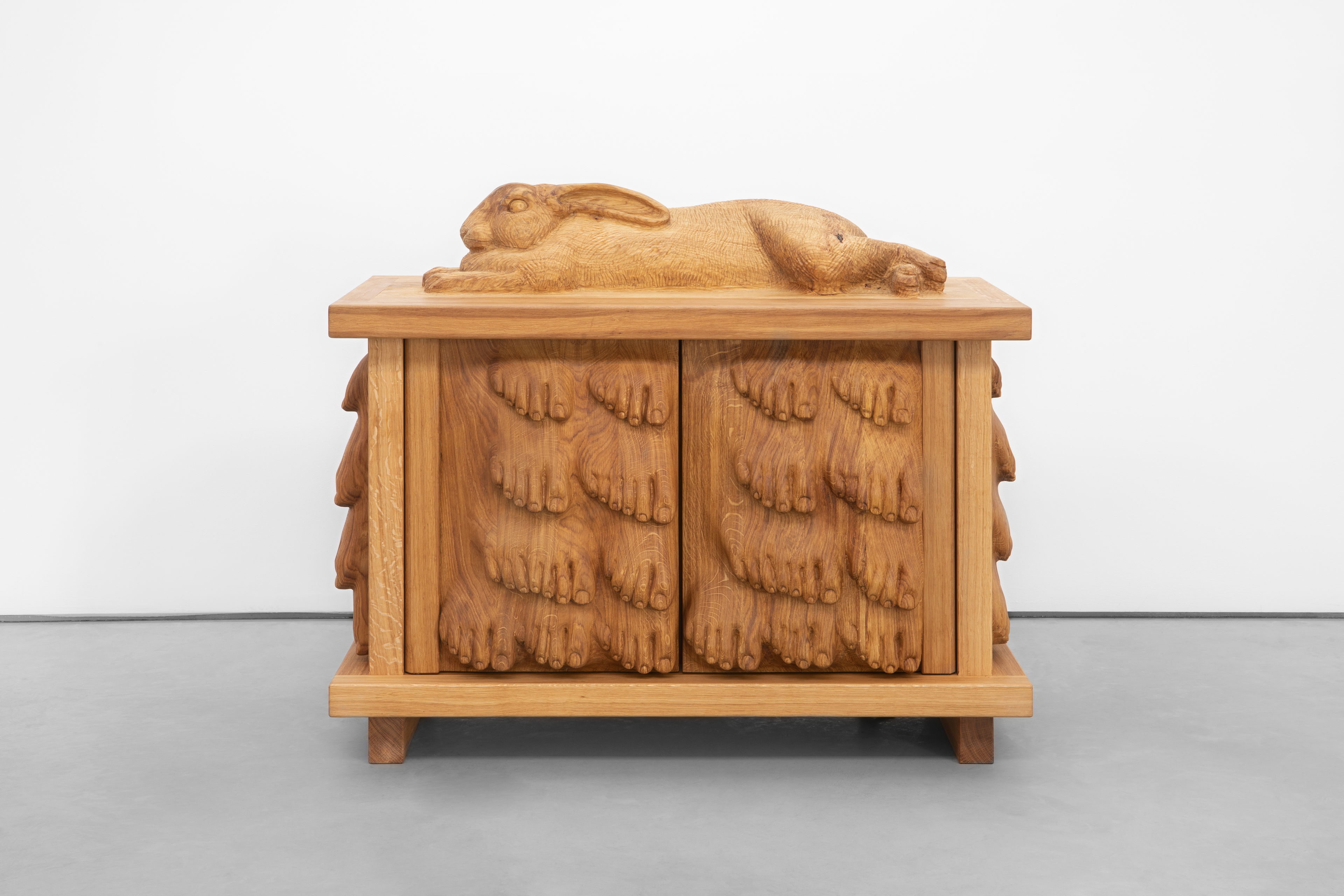 Oak cabinet with giant Flanders rabbit and feet