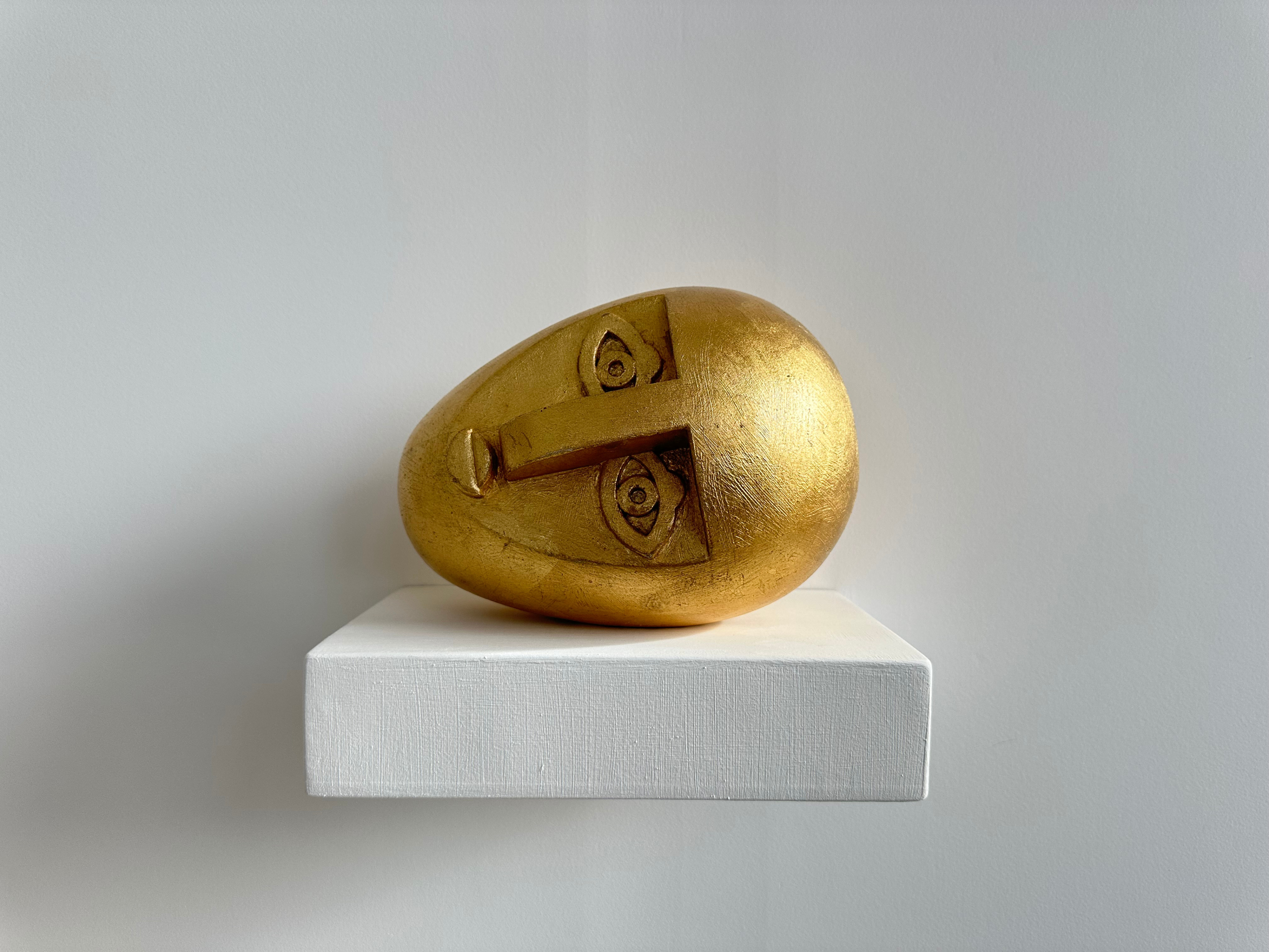 Reclining Head (gold)