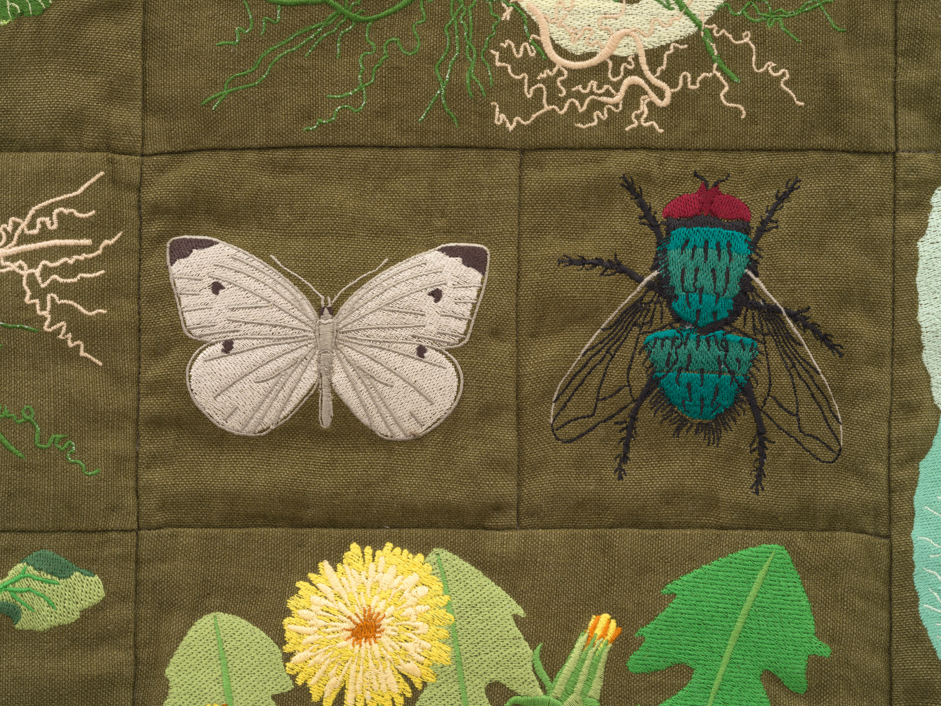 Embroidered quilt with earthworms, Brussels sprout plants, Savoy cabbage plants, cauliflowers plants...