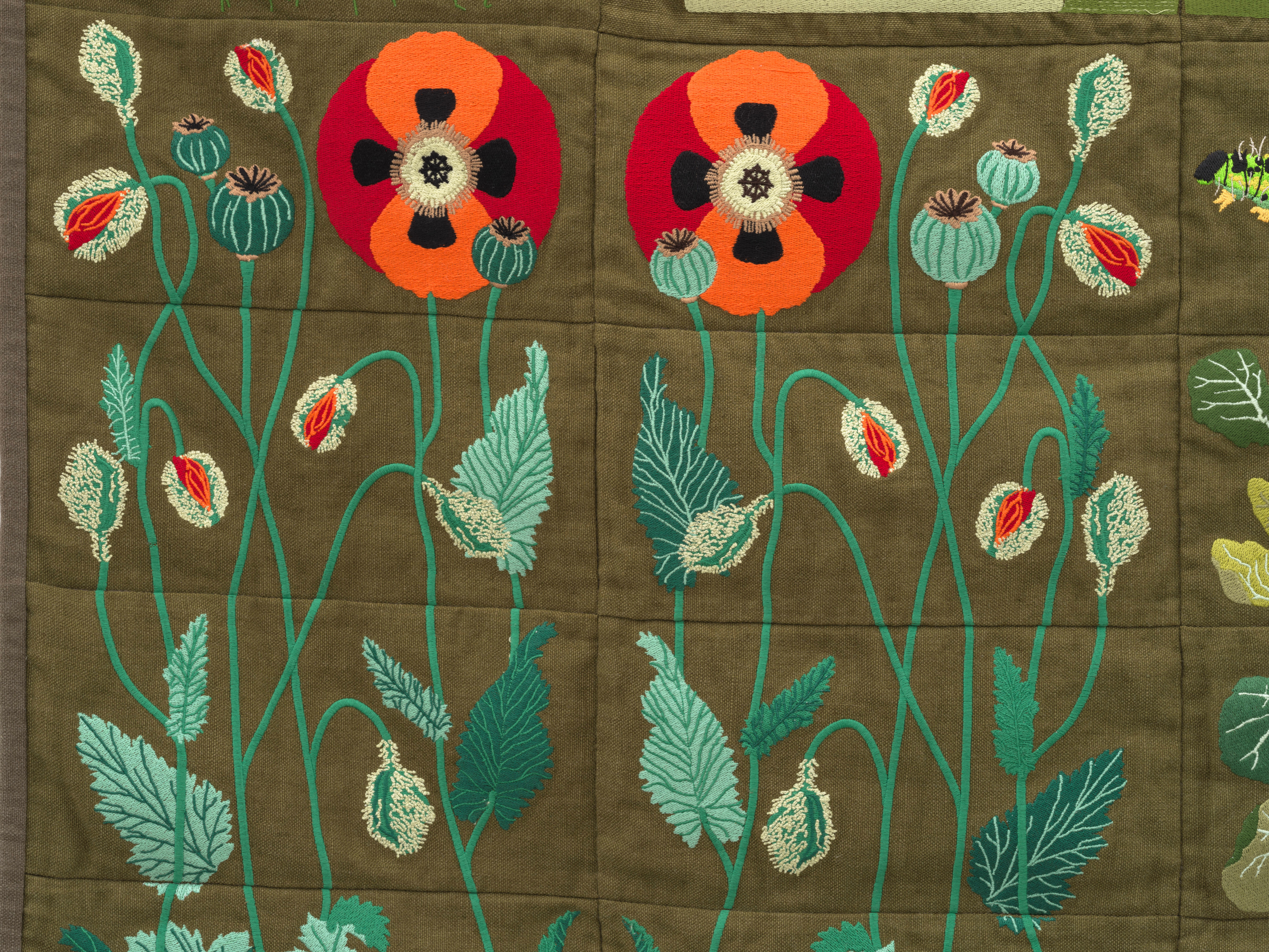 Embroidered quilt with earthworms, Brussels sprout plants, Savoy cabbage plants, cauliflowers plants...