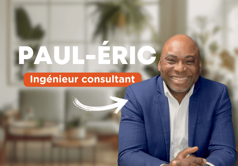 Paul-Éric, ingénieur consultant chez Extia, souriant et vêtu d'un costume bleu, assis dans un cadre professionnel lumineux.