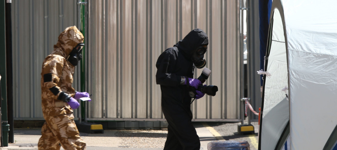 Officer checks out samples during an investigation Officer checks out samples during an investigation