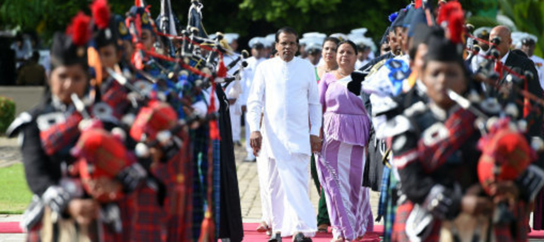 Sri Lankan President Maithripala Sirisena (Front C) arrives during a commemorative ceremony marking the 9th anniversary of the end of the island's civil war