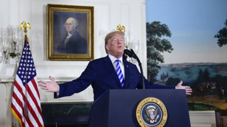 Theresa May condemns Donald Trump as US President axes 'rotten' Iran nuclear deal