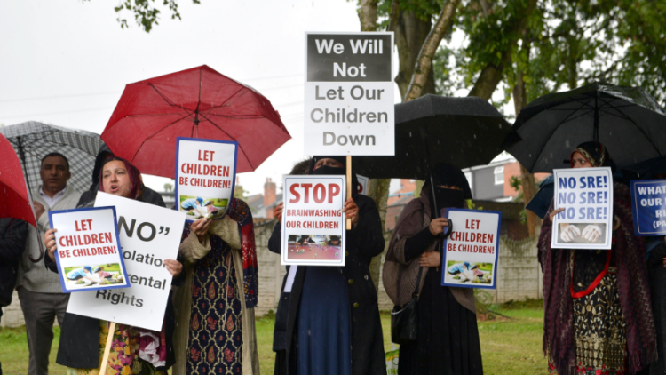 Theresa May defends LGBT education for primary children despite parent protests