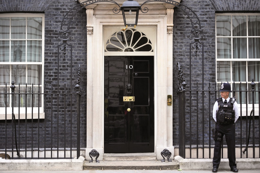 A police officer stands outside No.10 A police officer stands outside No.10