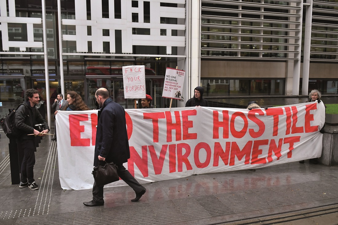 Demonstrators protest against the hostile environment immigration policy outside the Home Office Demonstrators protest against the hostile environment immigration policy outside the Home Office