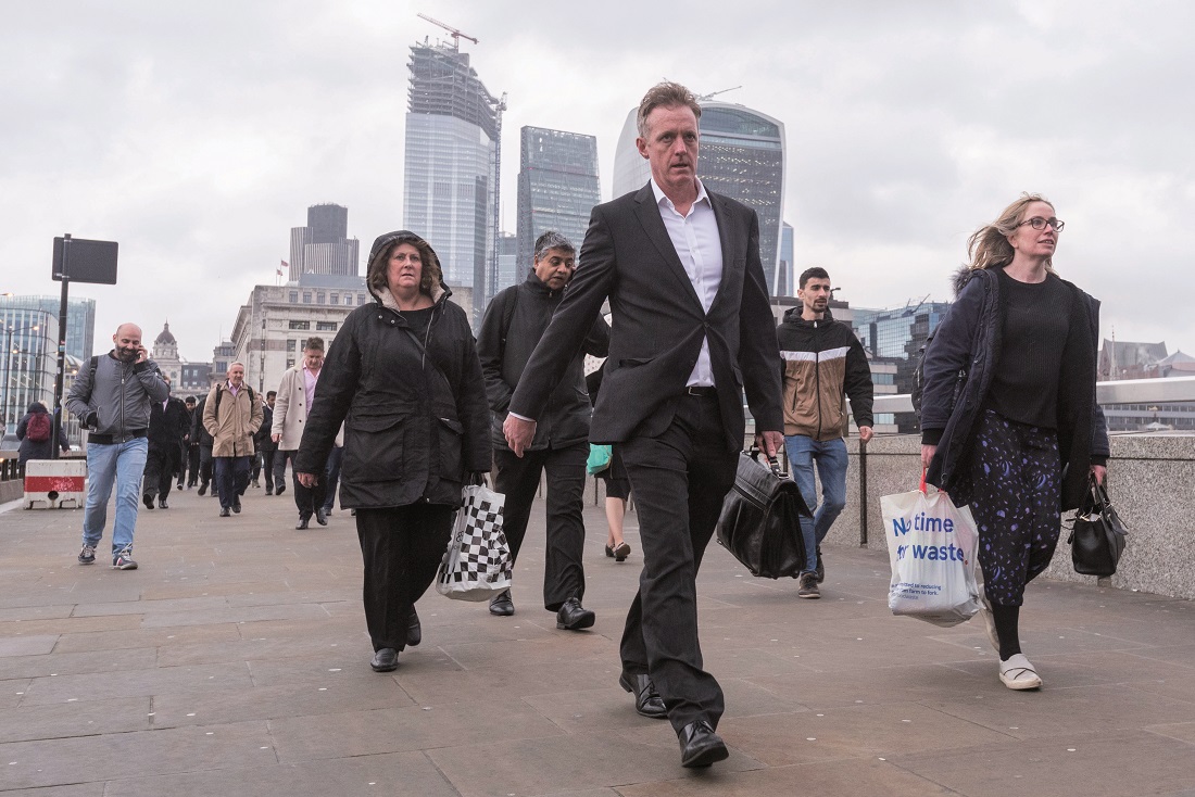 Commuters cross London Bridge Commuters cross London Bridge