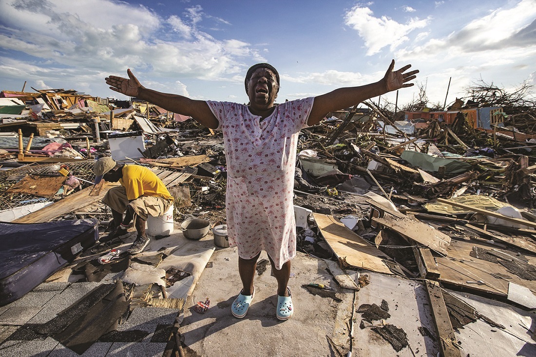 Aliana Alexis of Haiti stands on what is left of her home after destruction from Hurricane Dorian (Sep 2019) Aliana Alexis of Haiti stands on what is left of her home after destruction from Hurricane Dorian (Sep 2019)