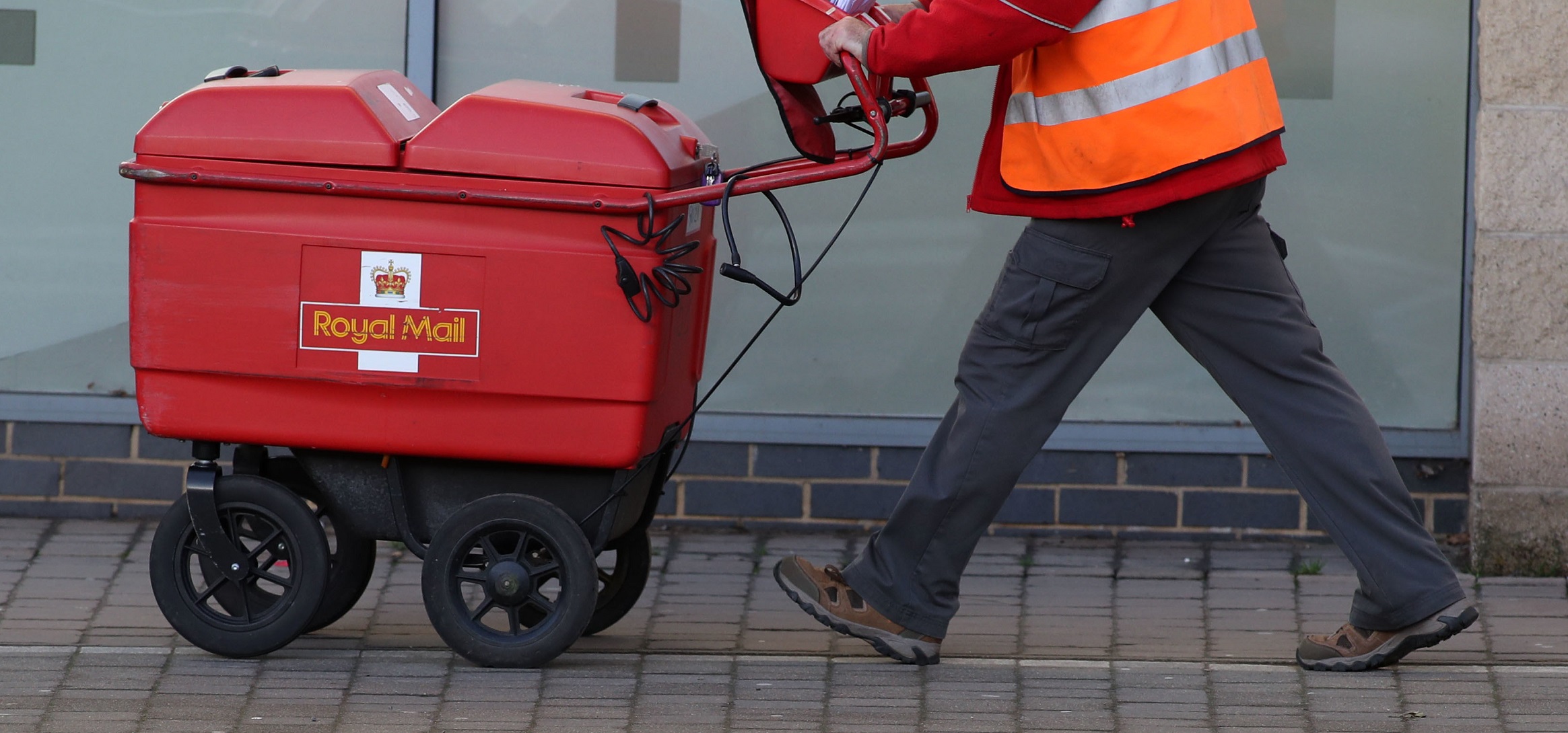 Royal Mail staff delivering letters Royal Mail staff delivering letters