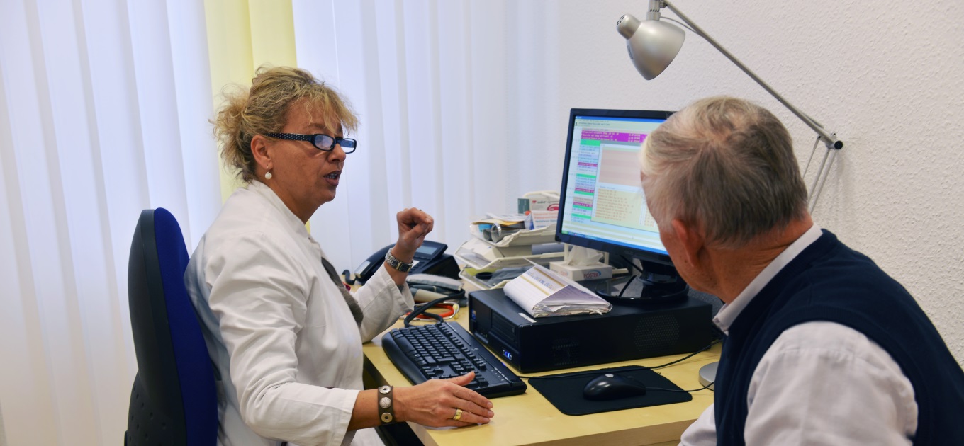 GP speaking with patient GP speaking with patient