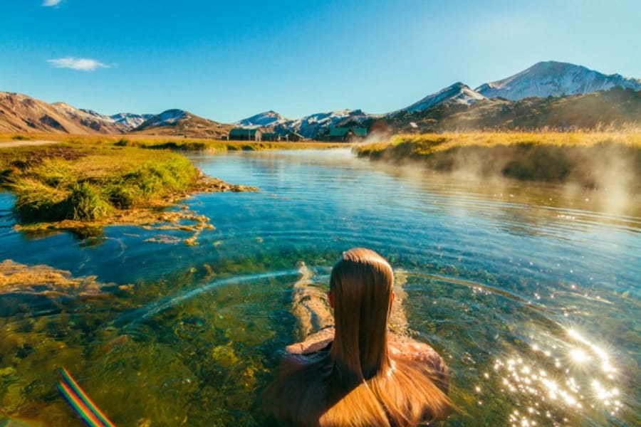 Natural hot spring of Landmannalaugar in early spring with the cloudy, dark sky