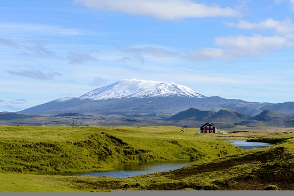 A rugged 4x4 super jeep traverses the colorful rhyolite mountains of the Icelandic Highlands