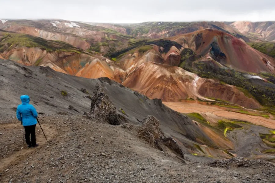 A tourist hiking on the Mt Brennisteinsalda trail in Landmannalaugar