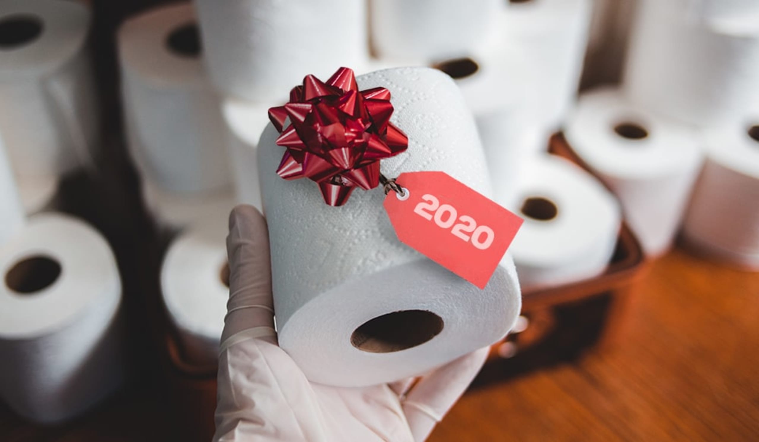 toilet paper with a red ribbon