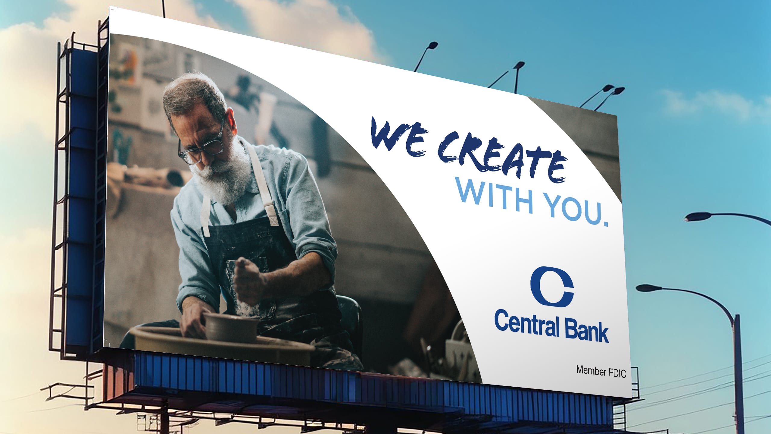 a central bank "we create with you" billboard with a potter on it