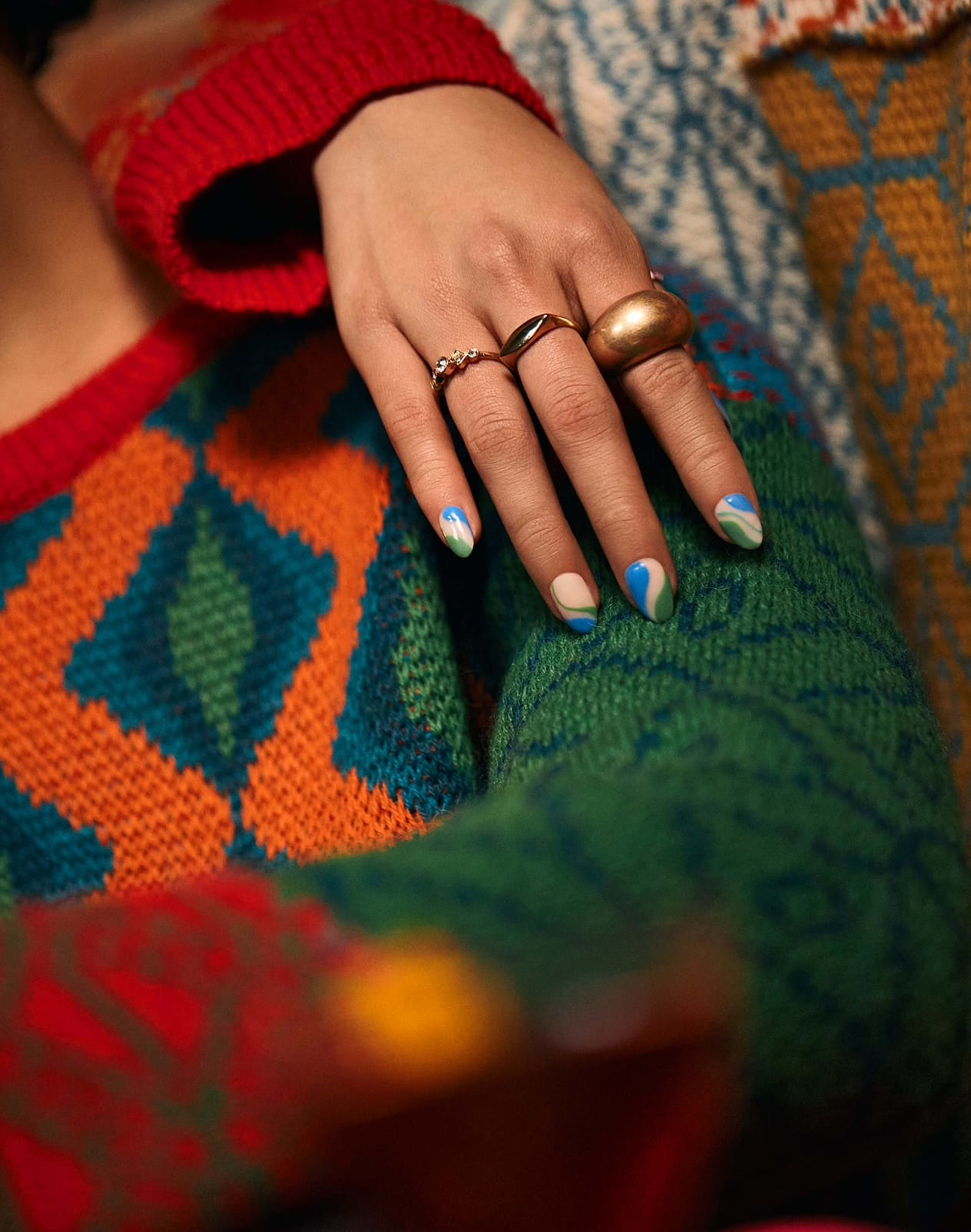 nails over sweater