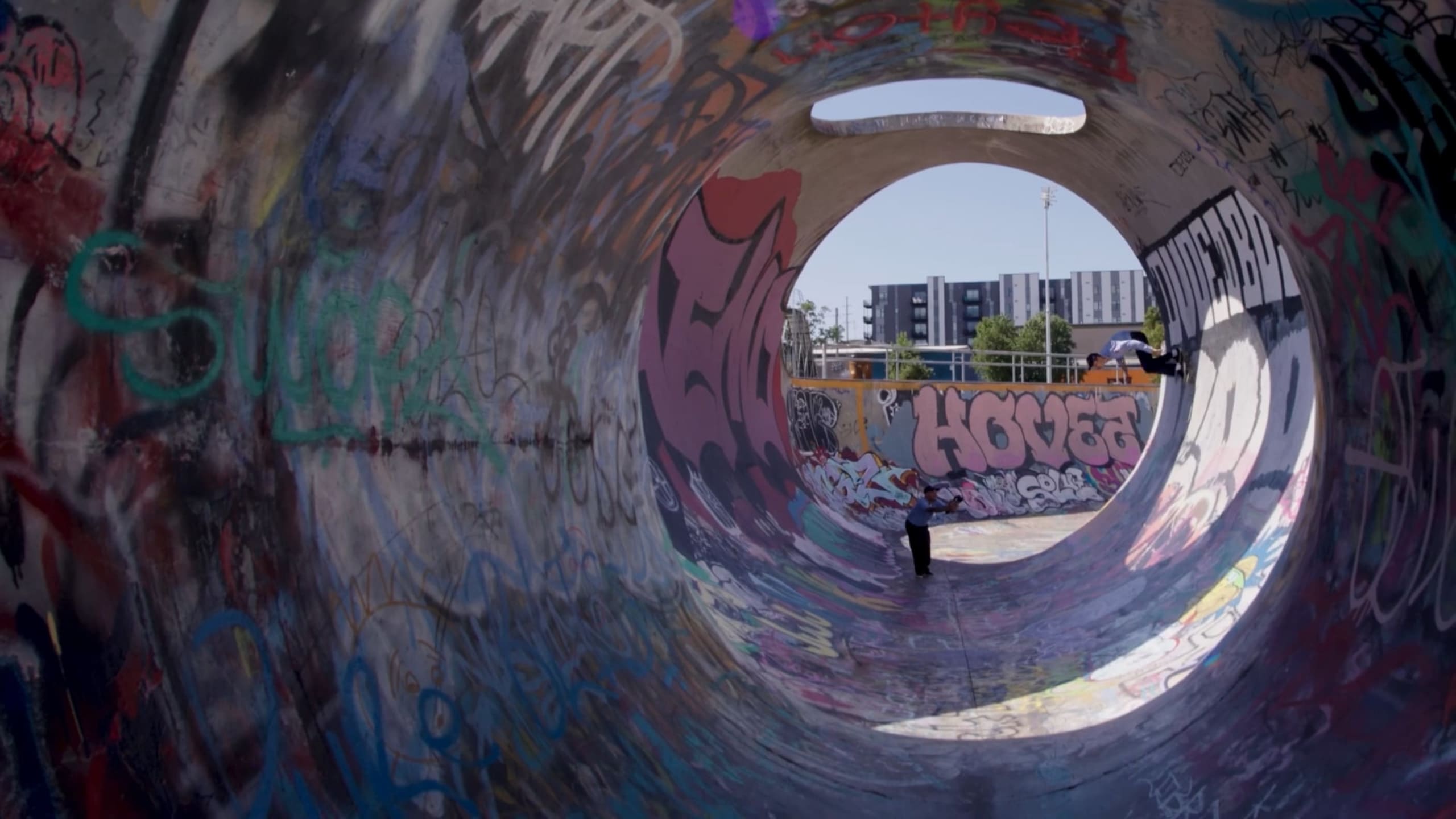 one roto-rooter tech recording another skateboarding in a tube