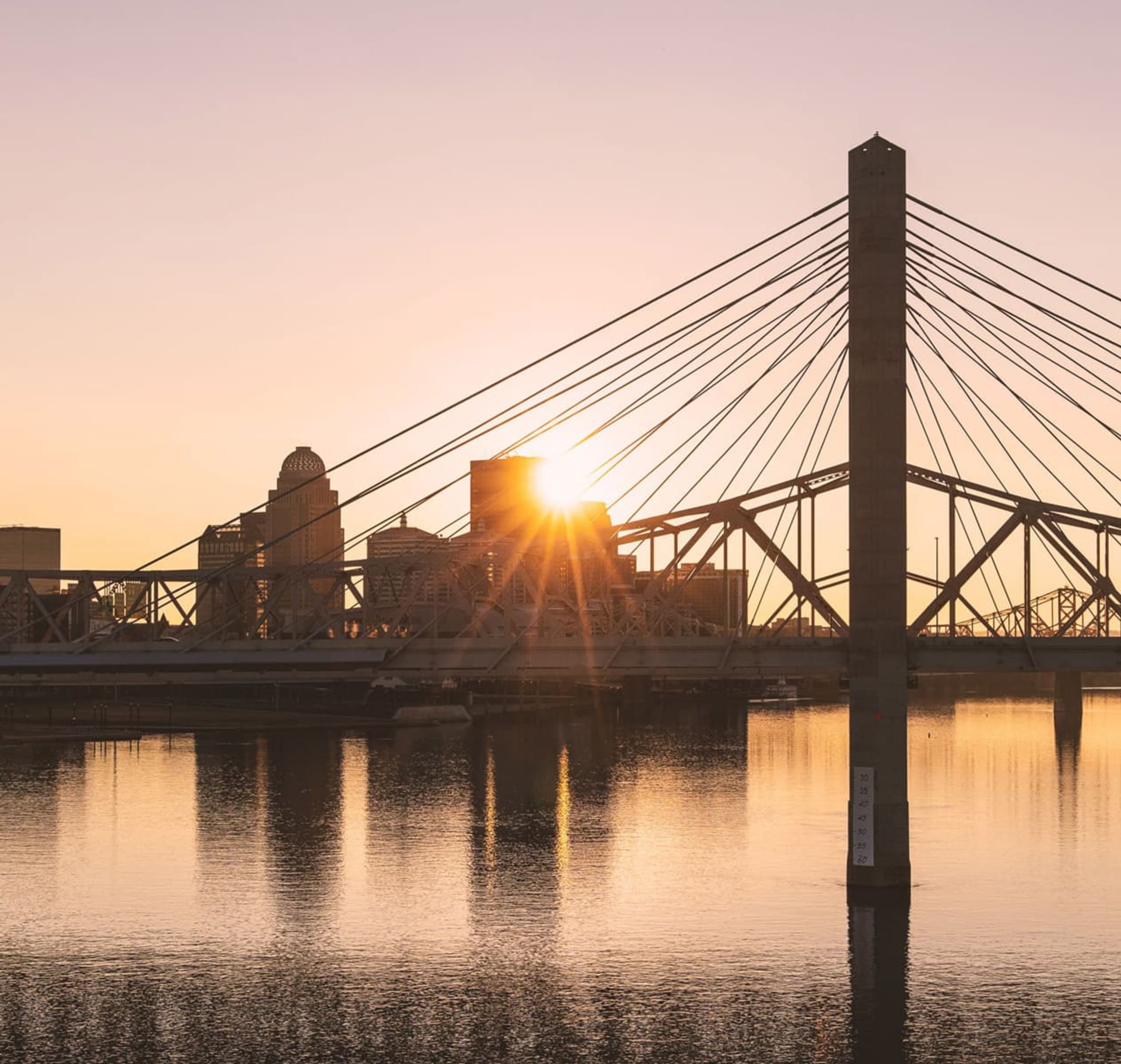 louisville kentucky water city skyline at sunset