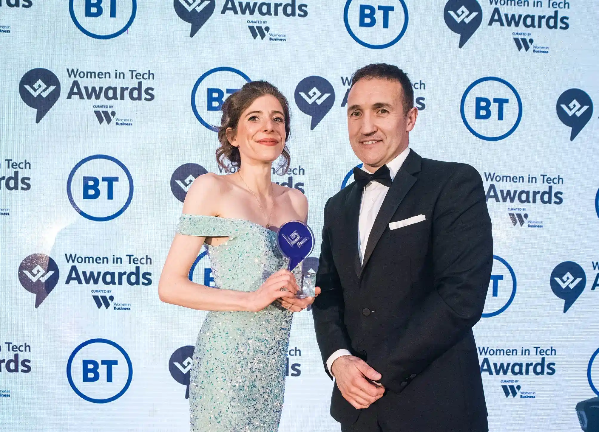 CEO emma mcclenaghan standing holding award for one to watch out for in the future sponsored by BT