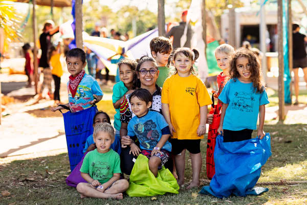 Cable Beach Primary School Pre-primary students and Aboriginal and Islander Education Officer, Shanice Flemming.