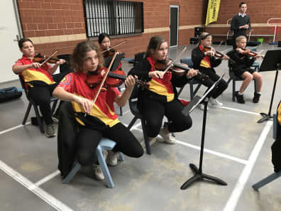 children playing violin