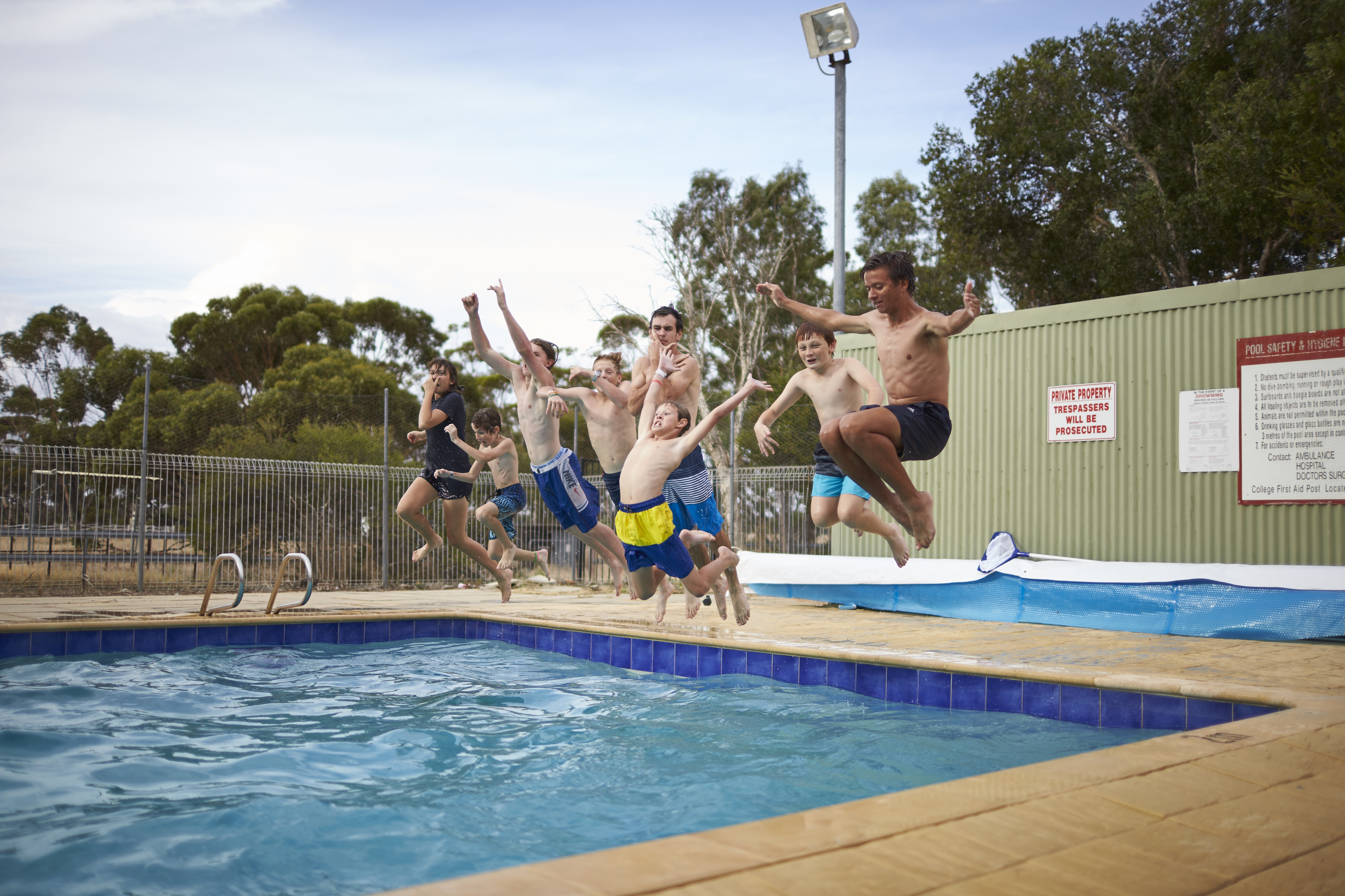 Moora Residential College students jumping in the pool