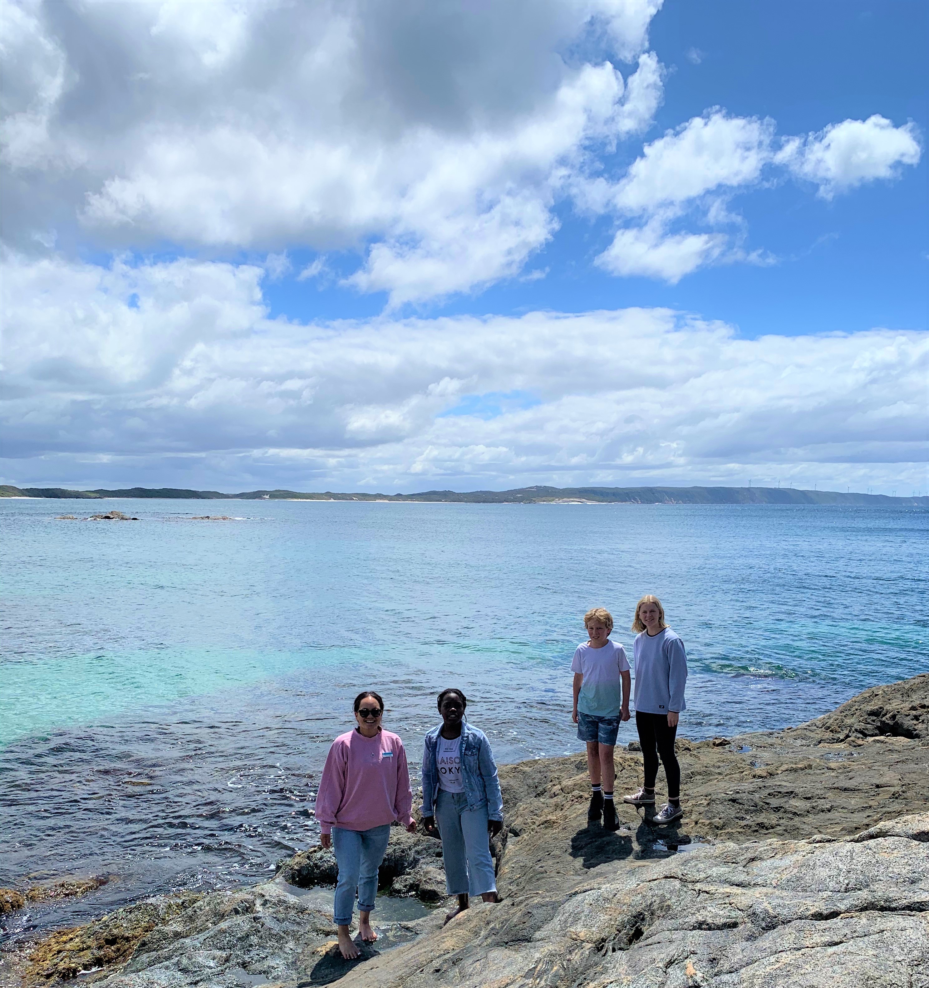 Pic of students standing on the rocky foreshore of Albany beach