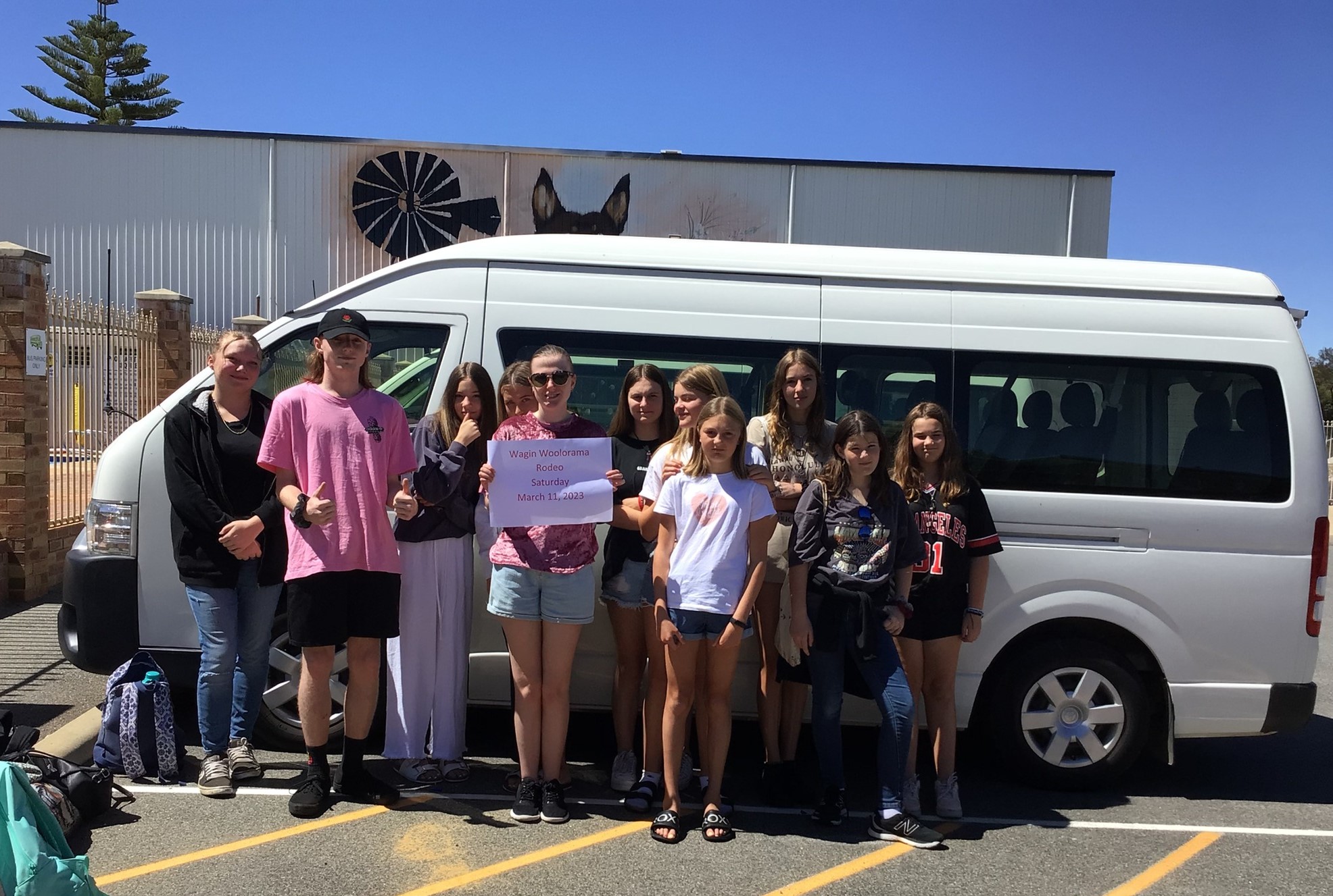 Narrogin Residential College boarders standing by the college bus